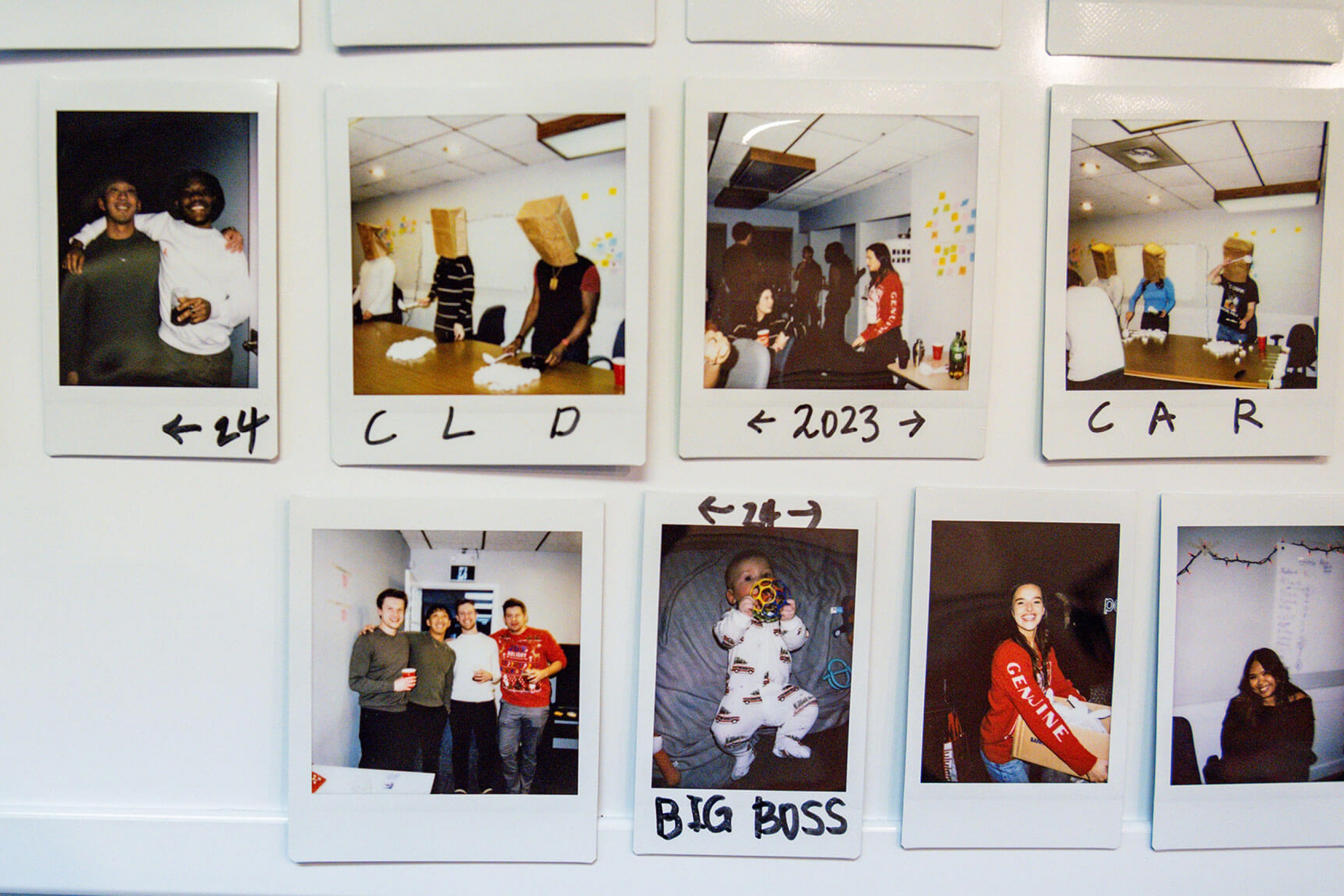 Polaroid images of employees at a party at Chris Schmidt's Winnipeg headquarters