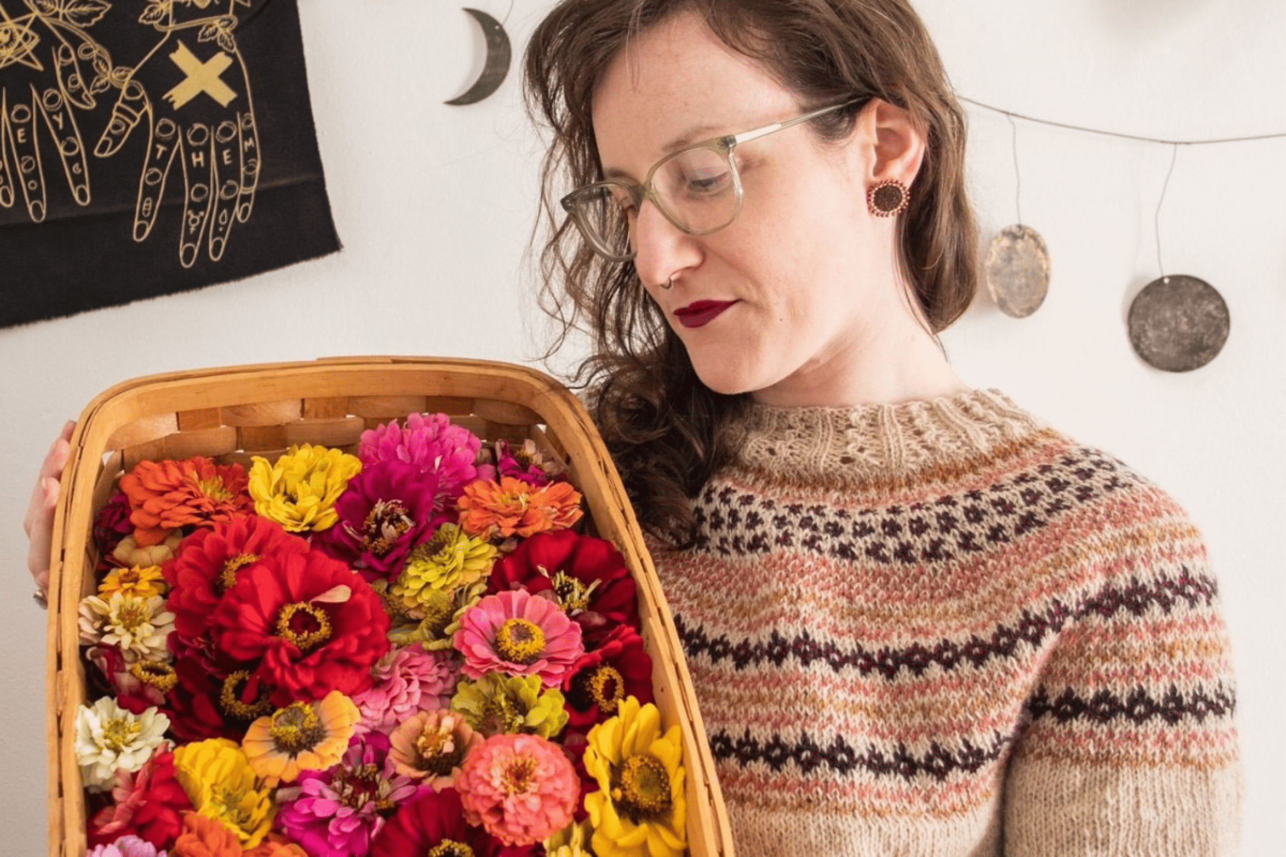 woman posing with basket of flowers