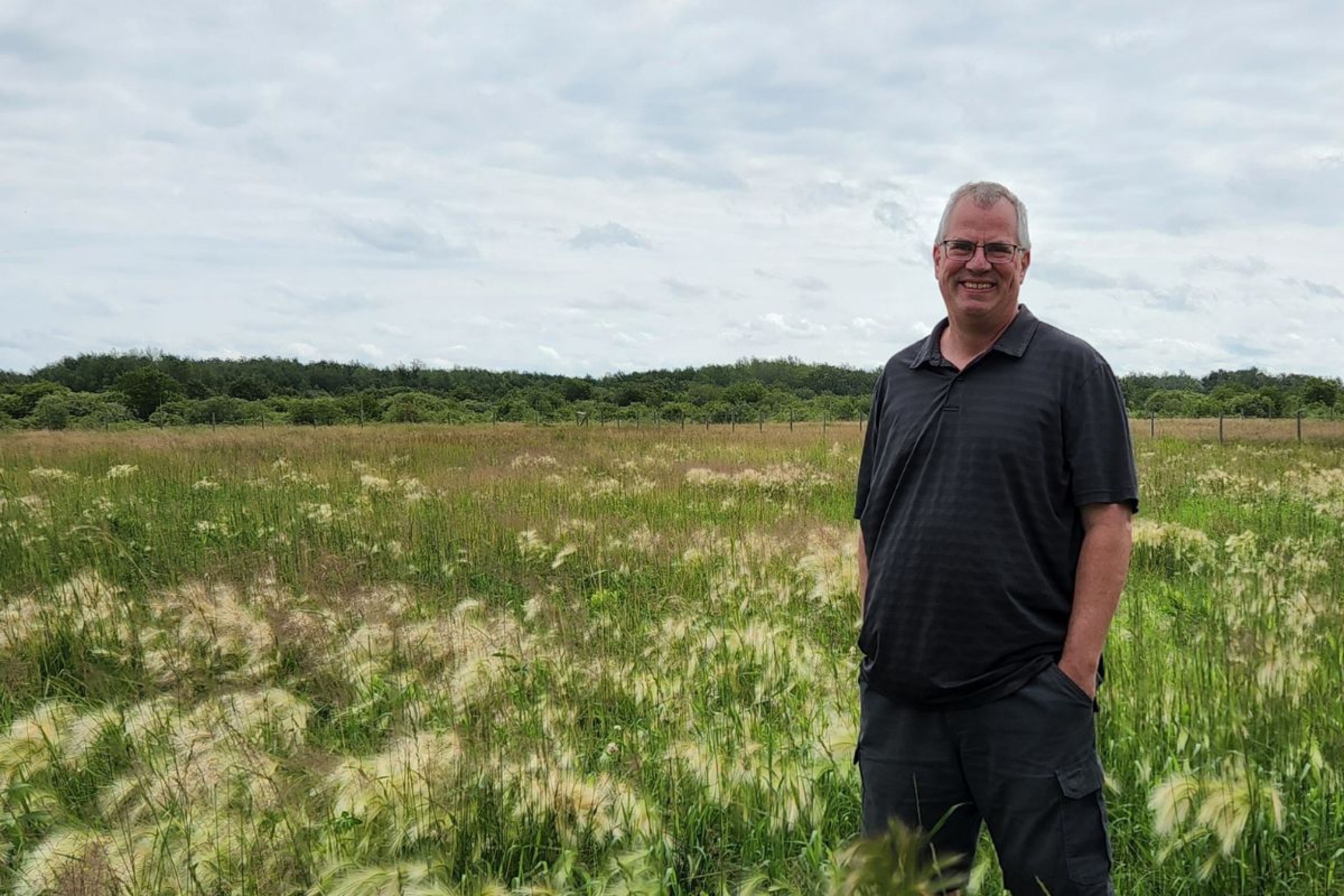 Bruno Dyck stands at Long Way Homestead