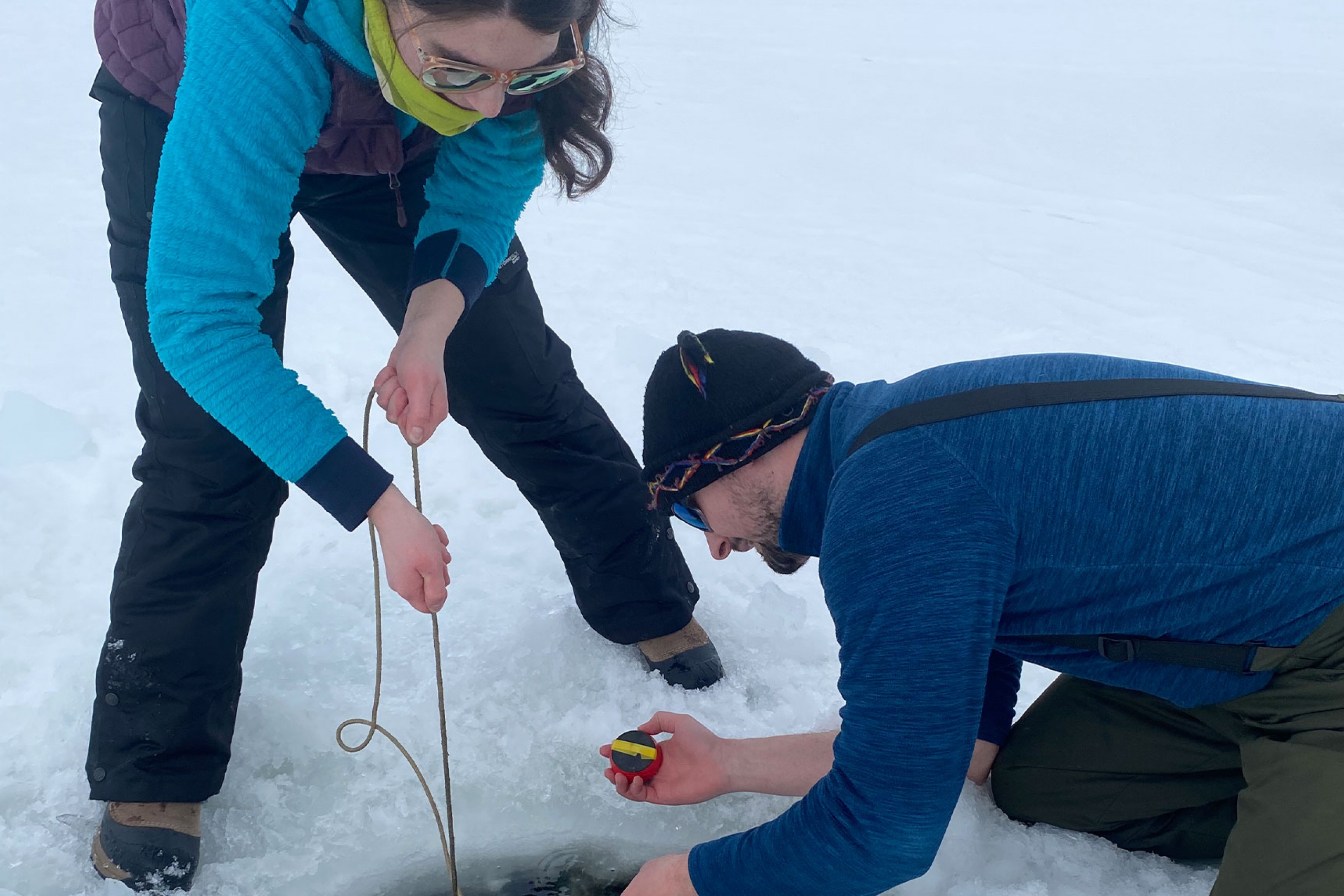 Dr. Cale Gushulak with a student during their fieldwork.