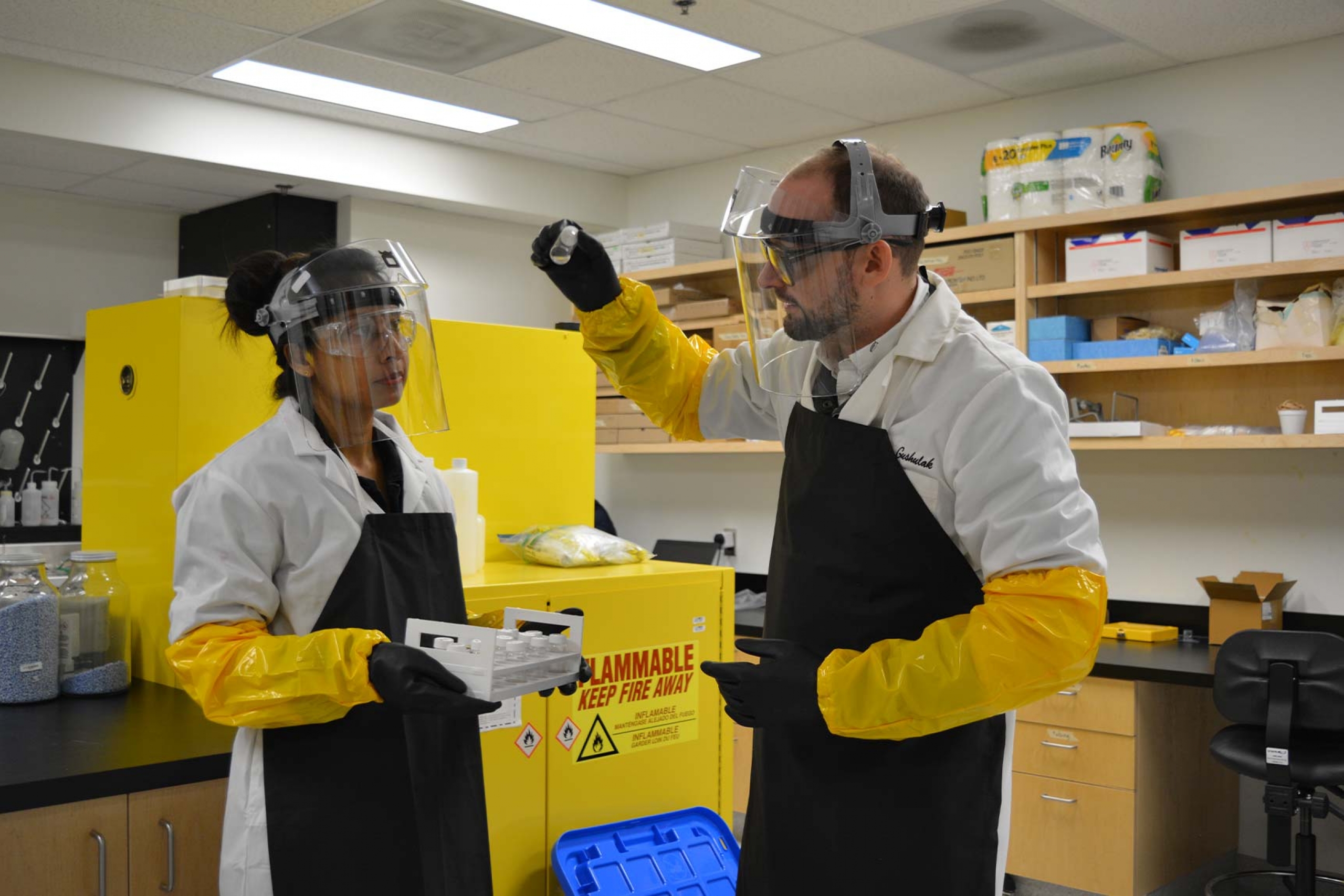Cale working with student in the lab.