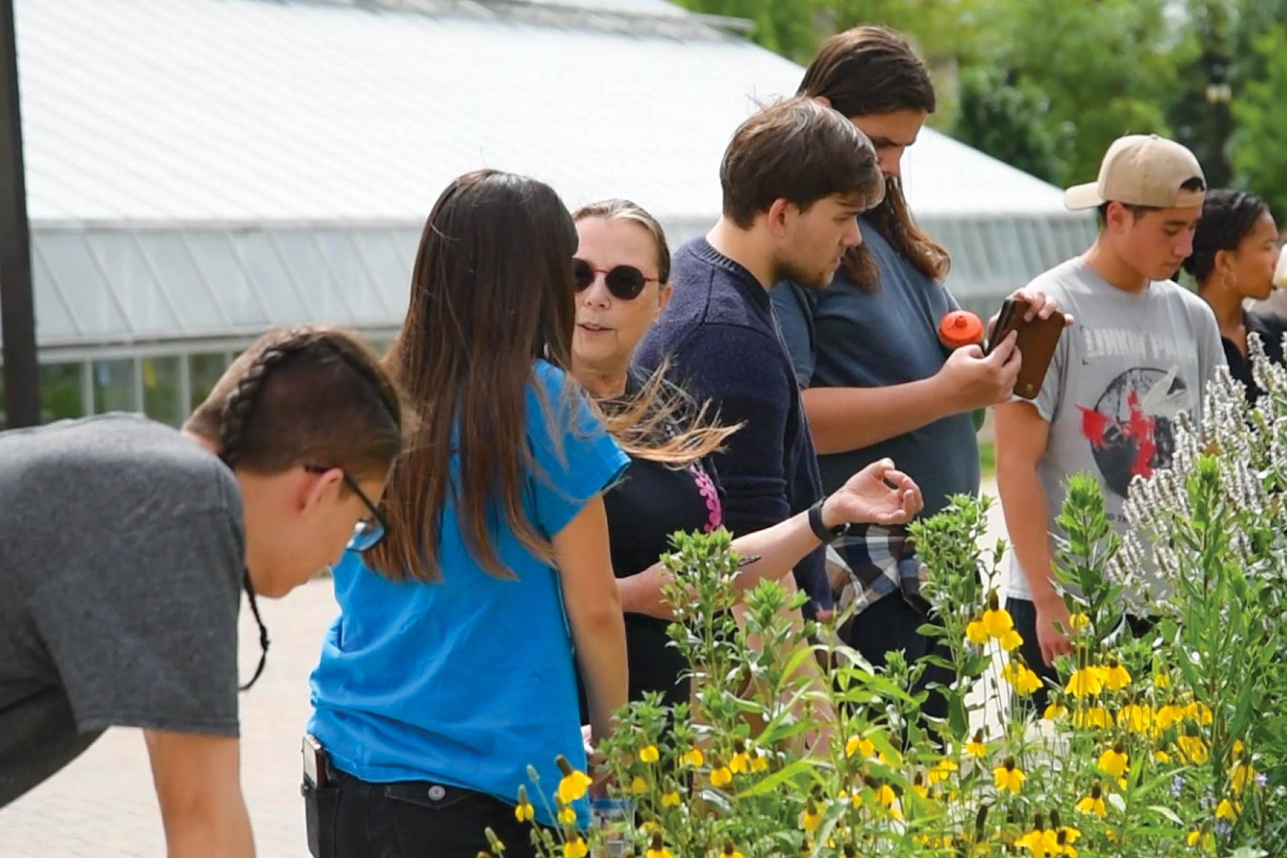 Carla Zelmer talking about the outdoor plants near the buller greenhouse.