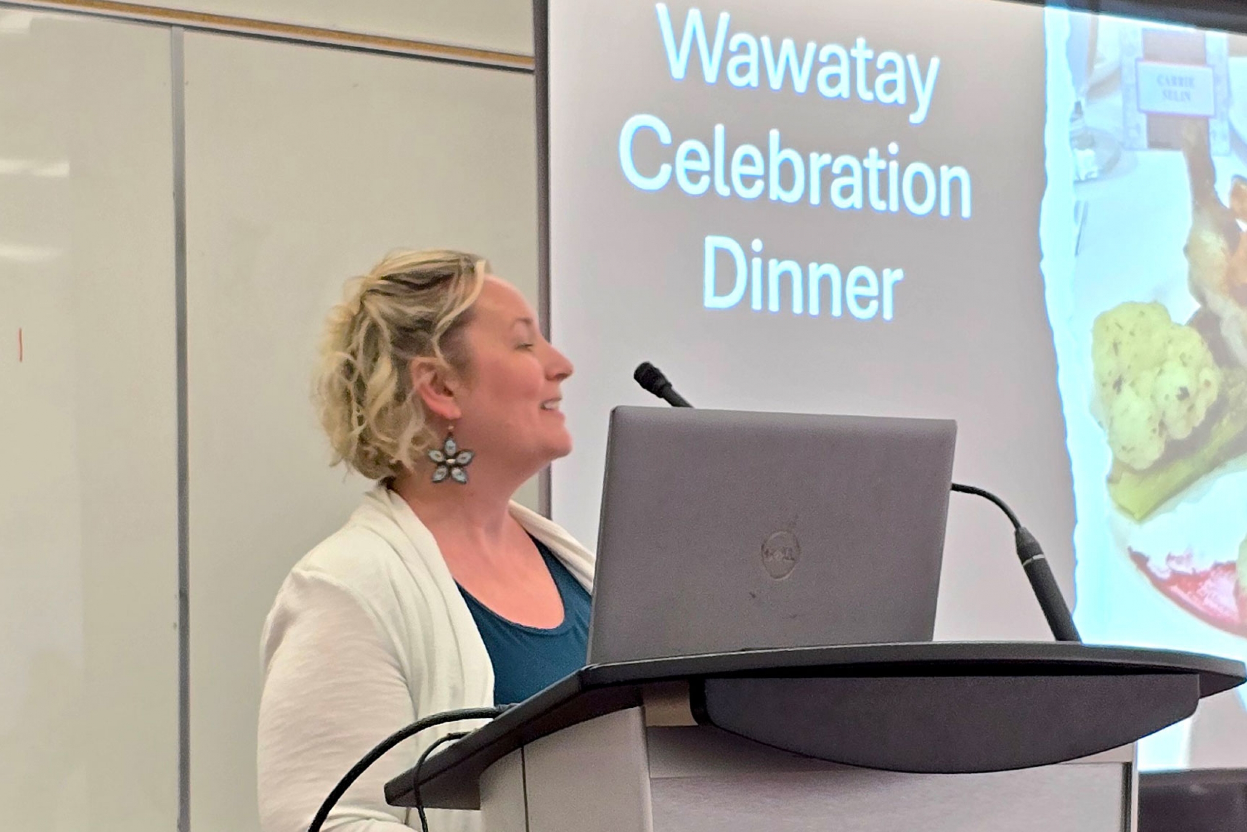 Carrie Selin speaking at the podium during the Wawatay dinner celebration.