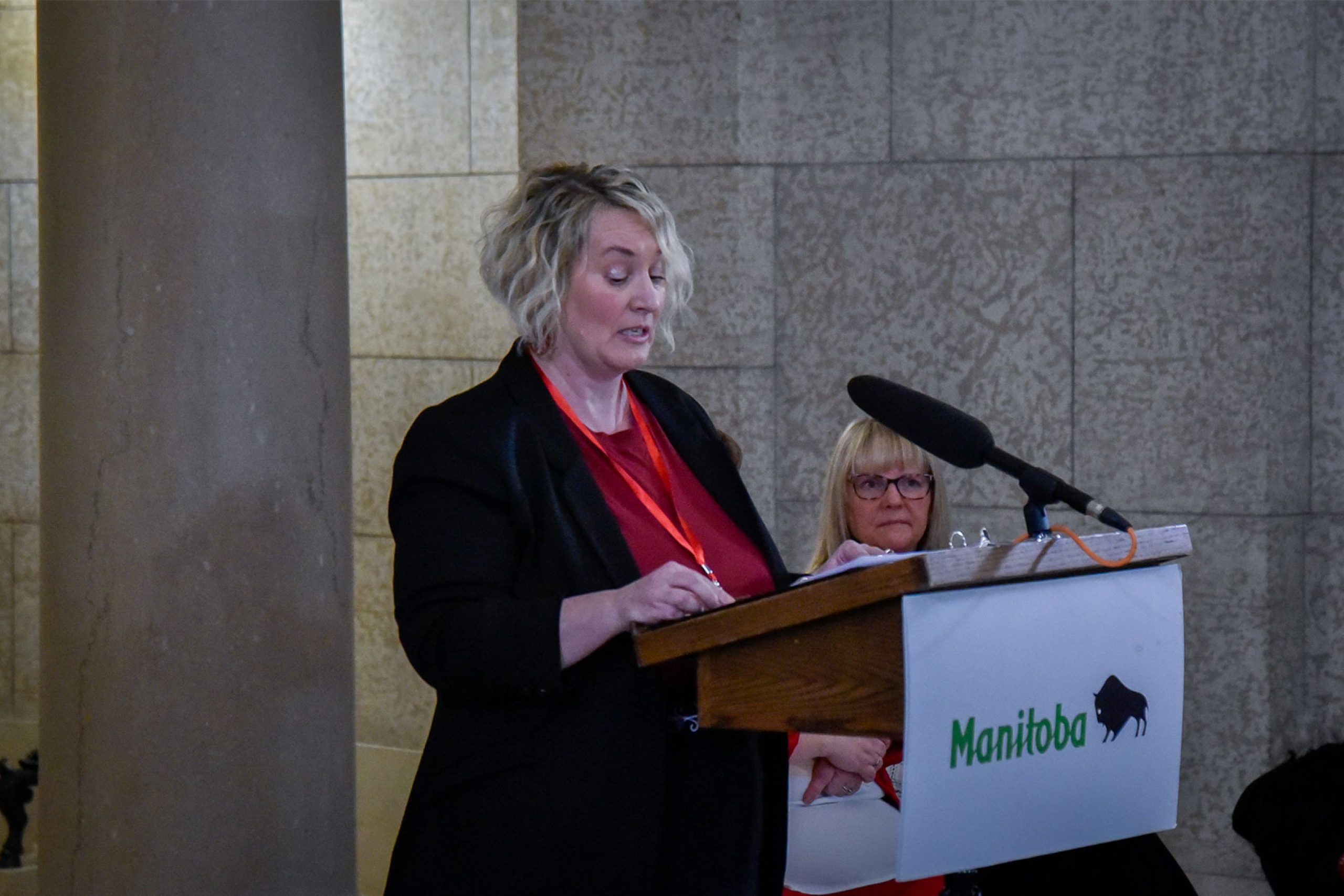 Carrie Selin as the keyspeaker in the legislative building.