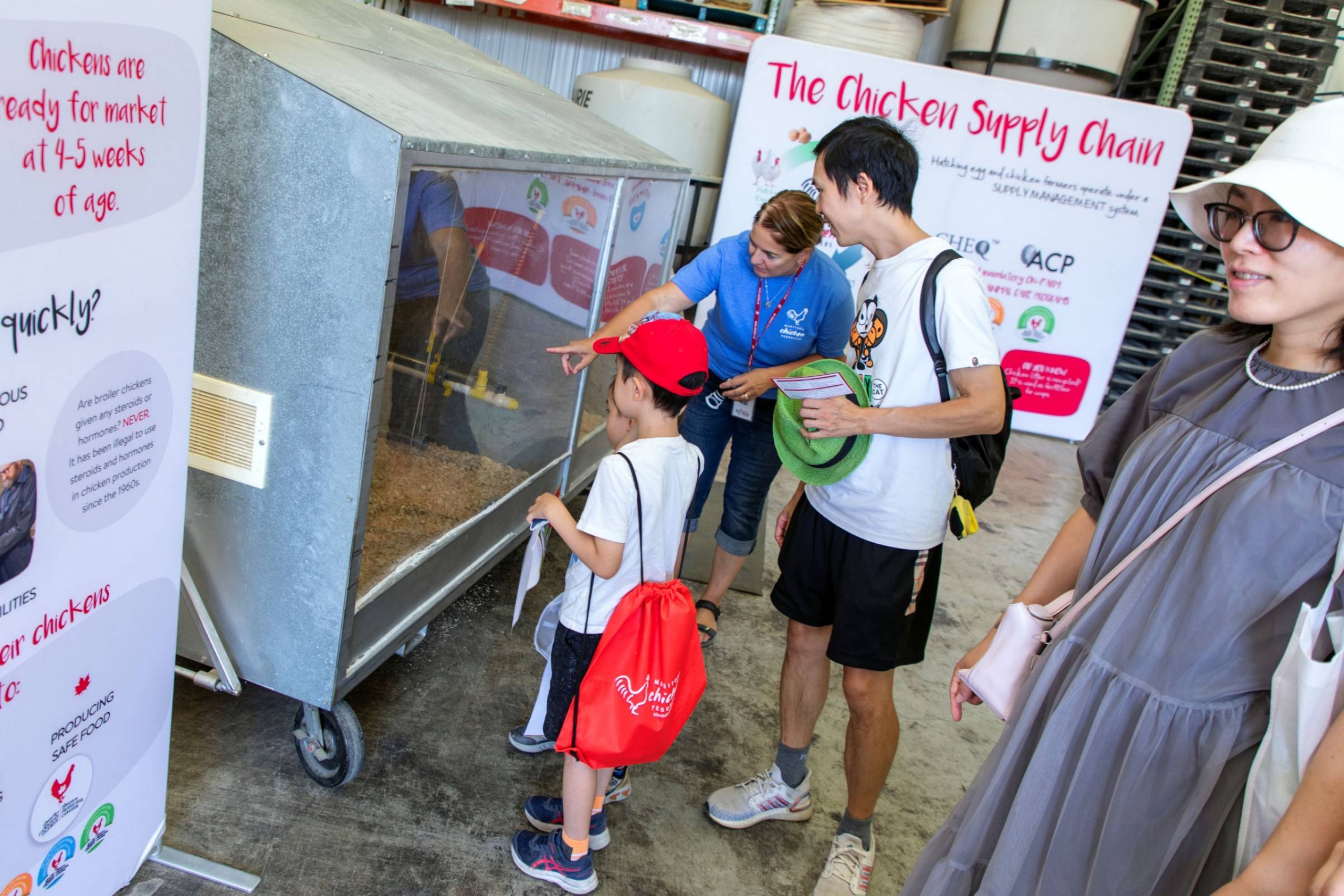 People the poultry exhibit at Discover Agriculture on the Farm