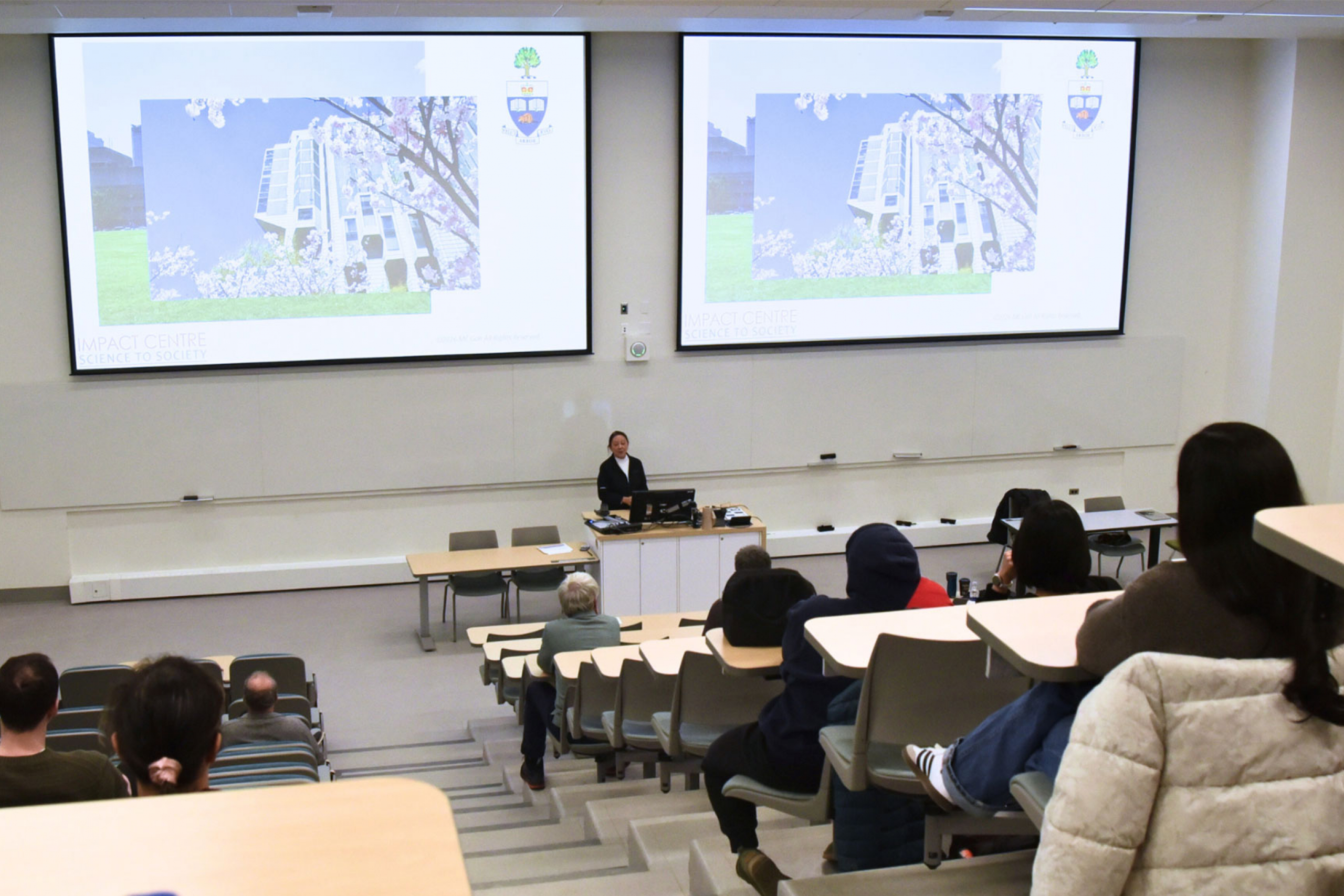 Cynthia Goh with her presentation on the screen.