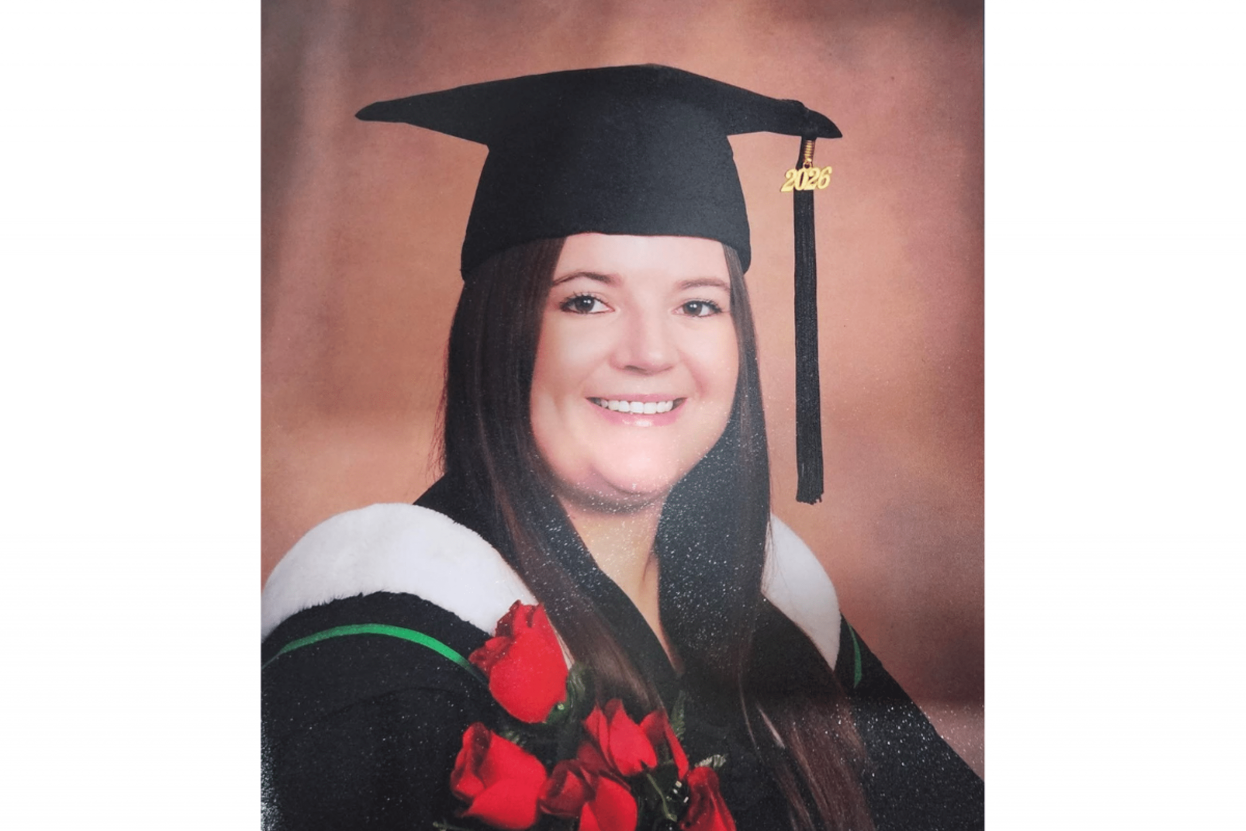 female graduate wearing cap and gown
