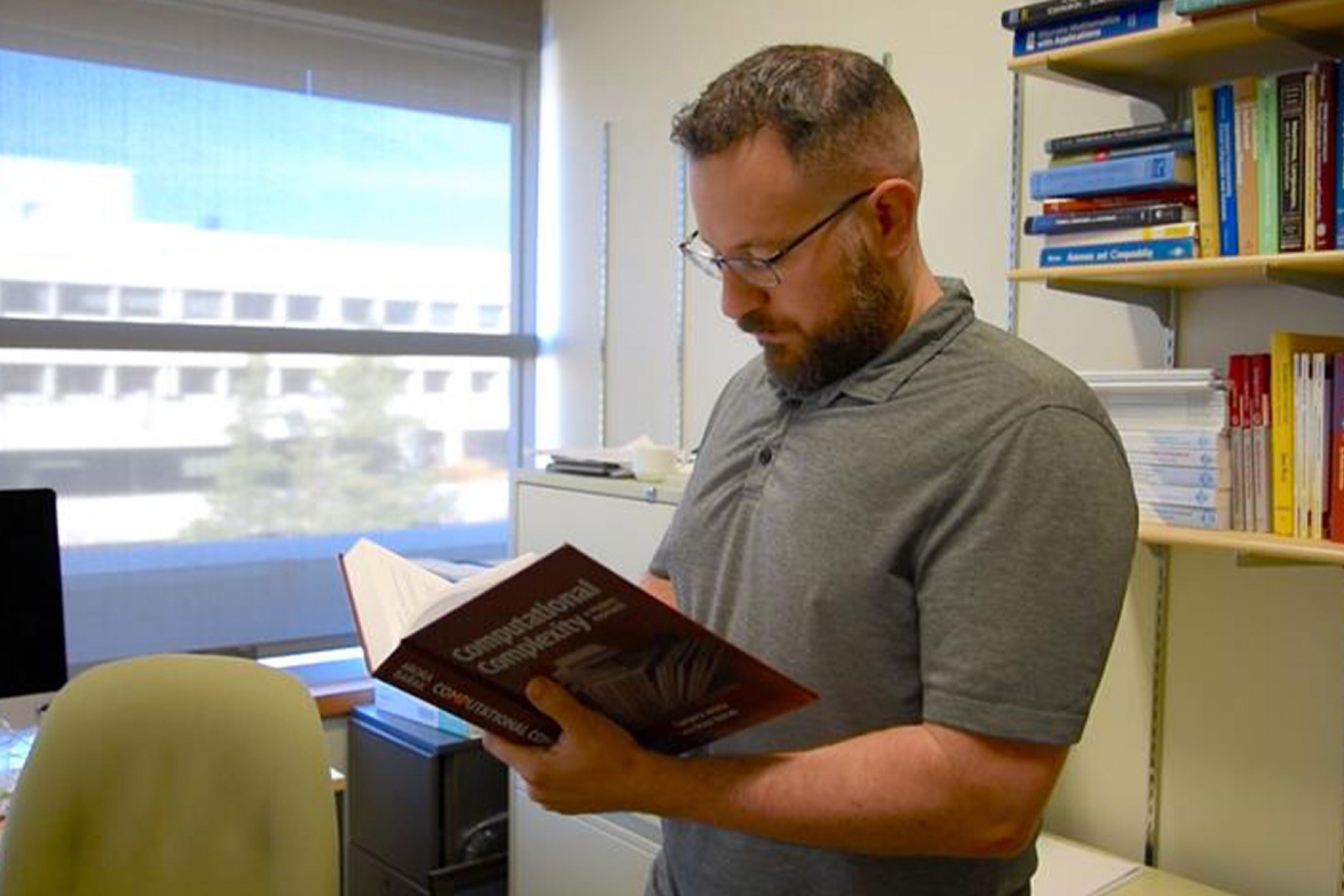 Dr. Avery Miller reading a book.