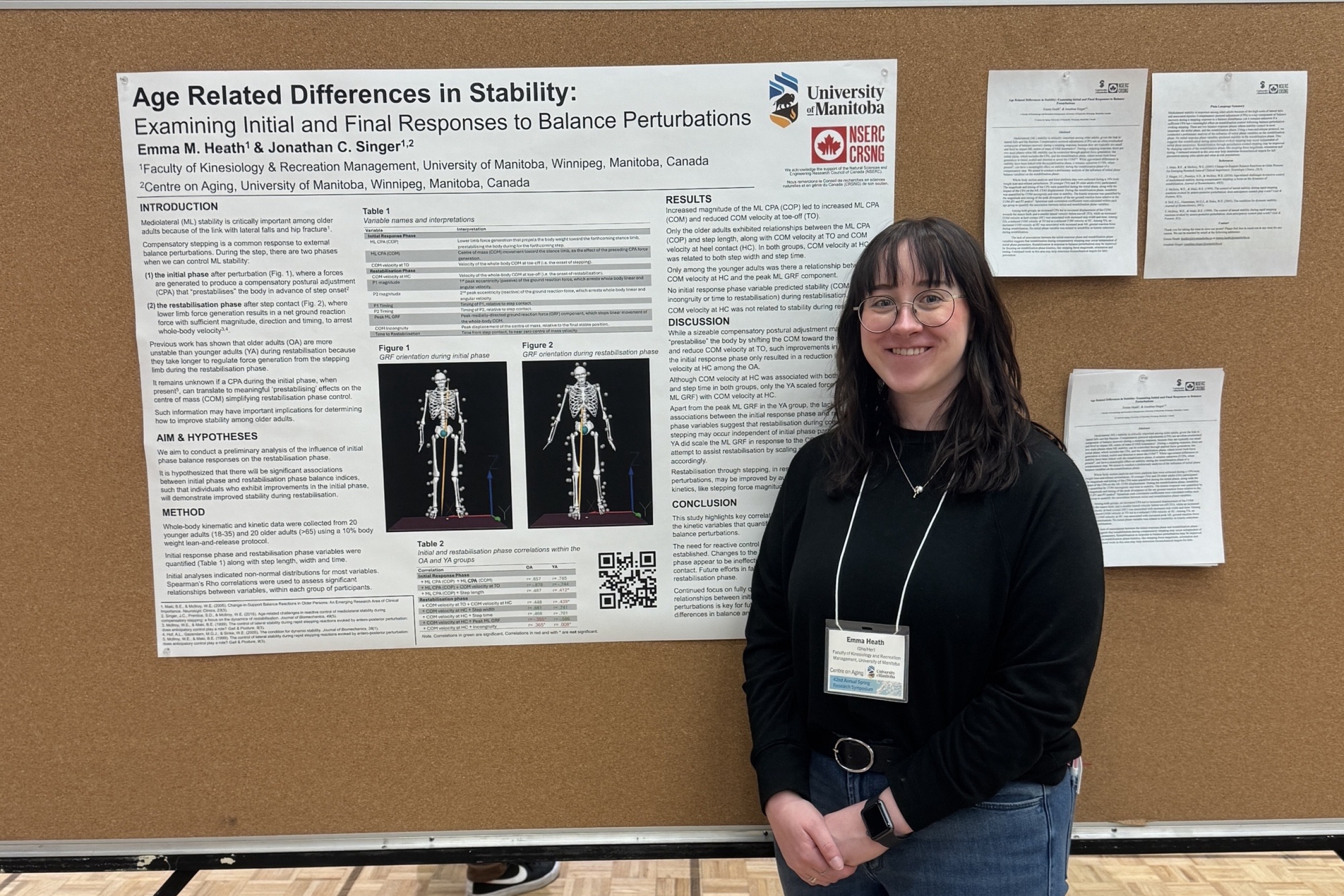 Emma Heath standing in front of a research poster during a presentation competition