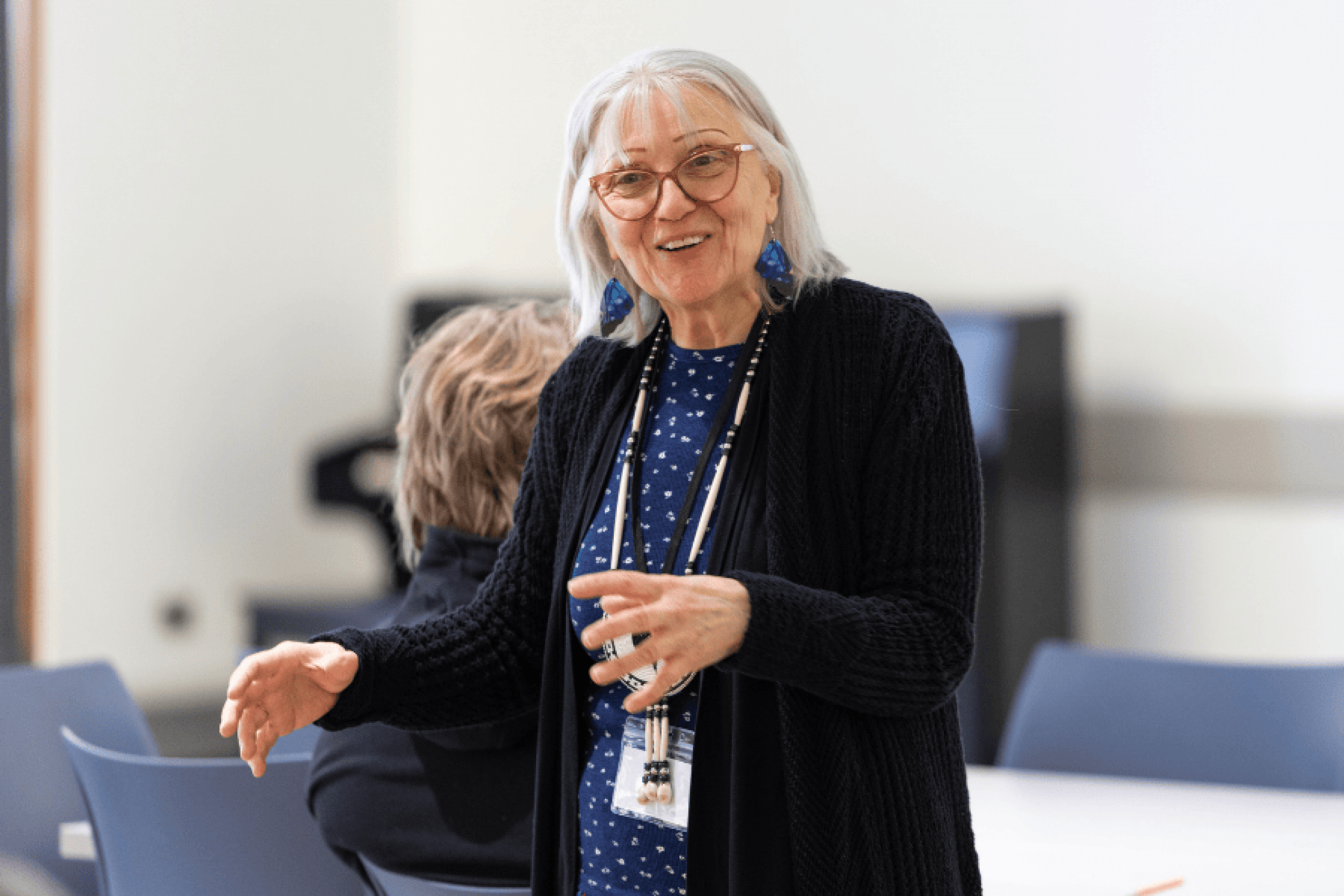 An Elder speaks and gestures during a session at the Elders and Traditional Peoples Gathering (ETPG).