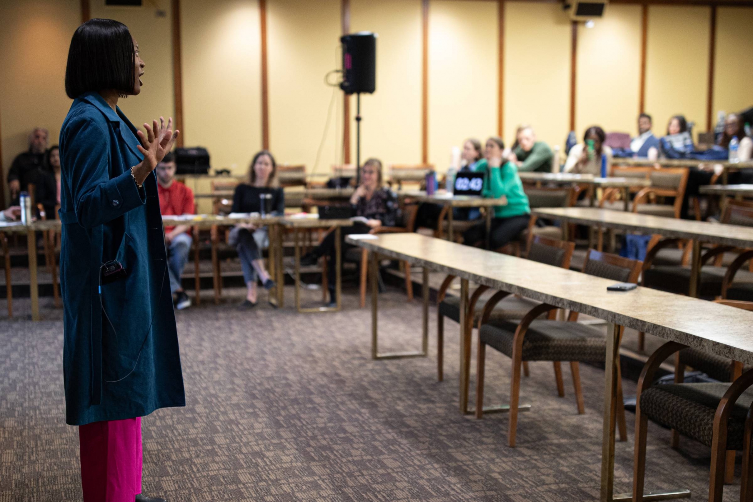 Foluke Oyekale presenting in a classroom.