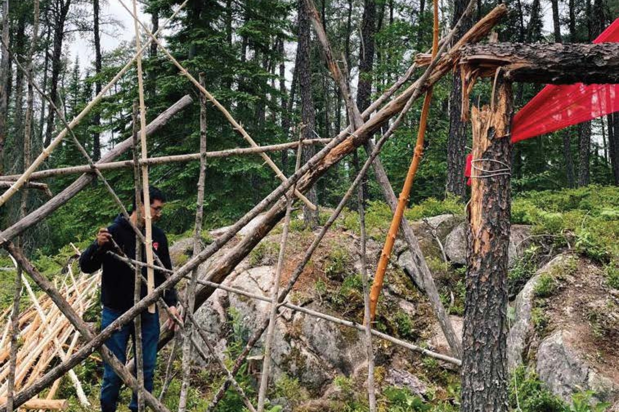 a person working on the outdoor shelter
