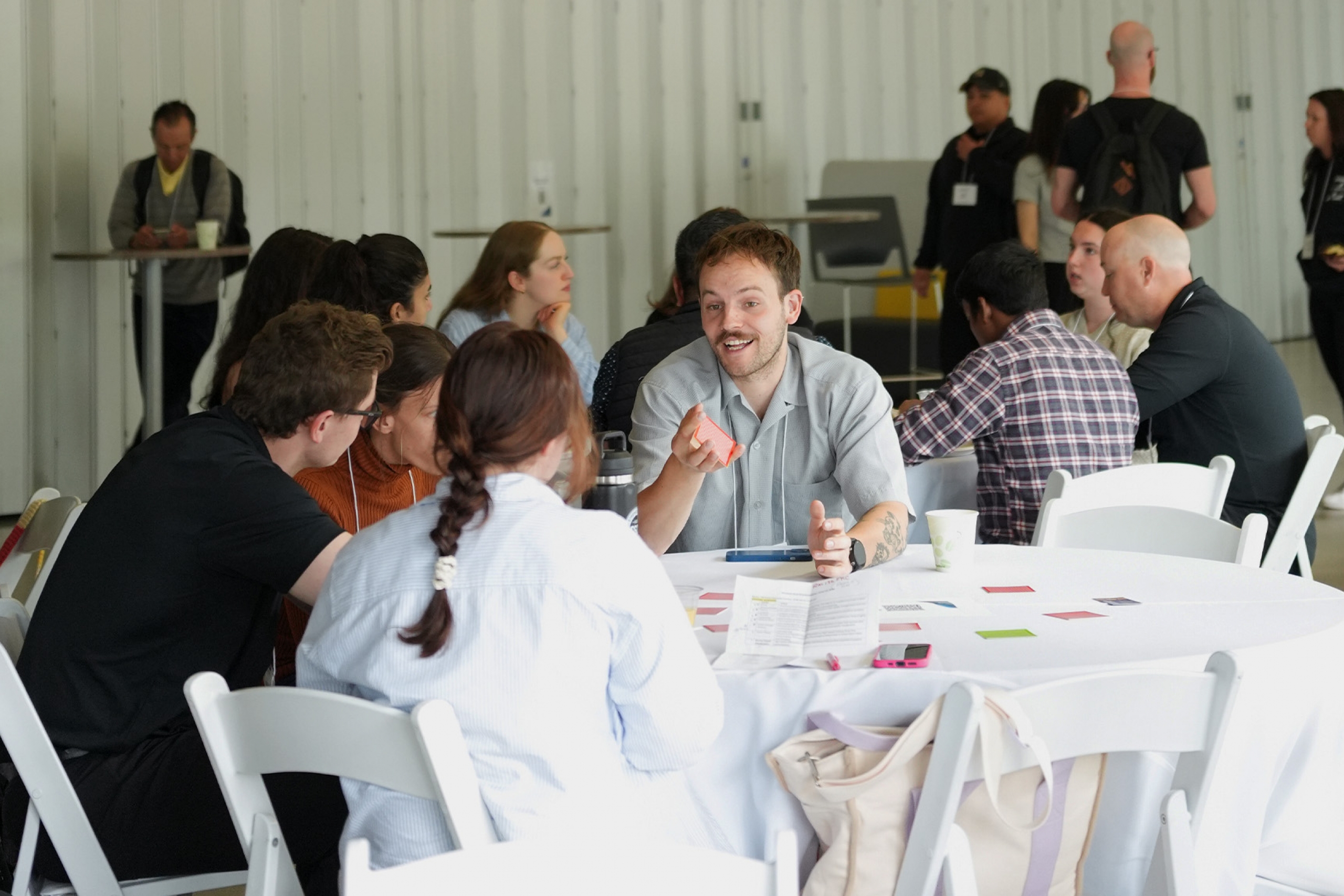 A group of students sitting at a table chatting
