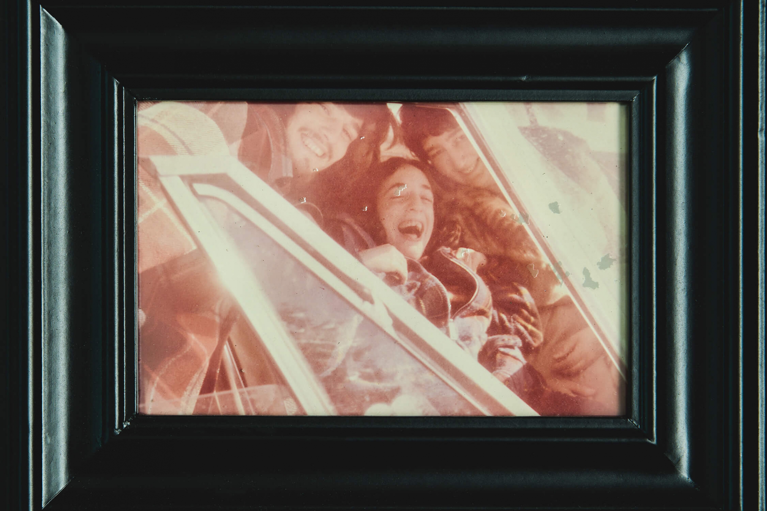 A picture frame showing a family photo