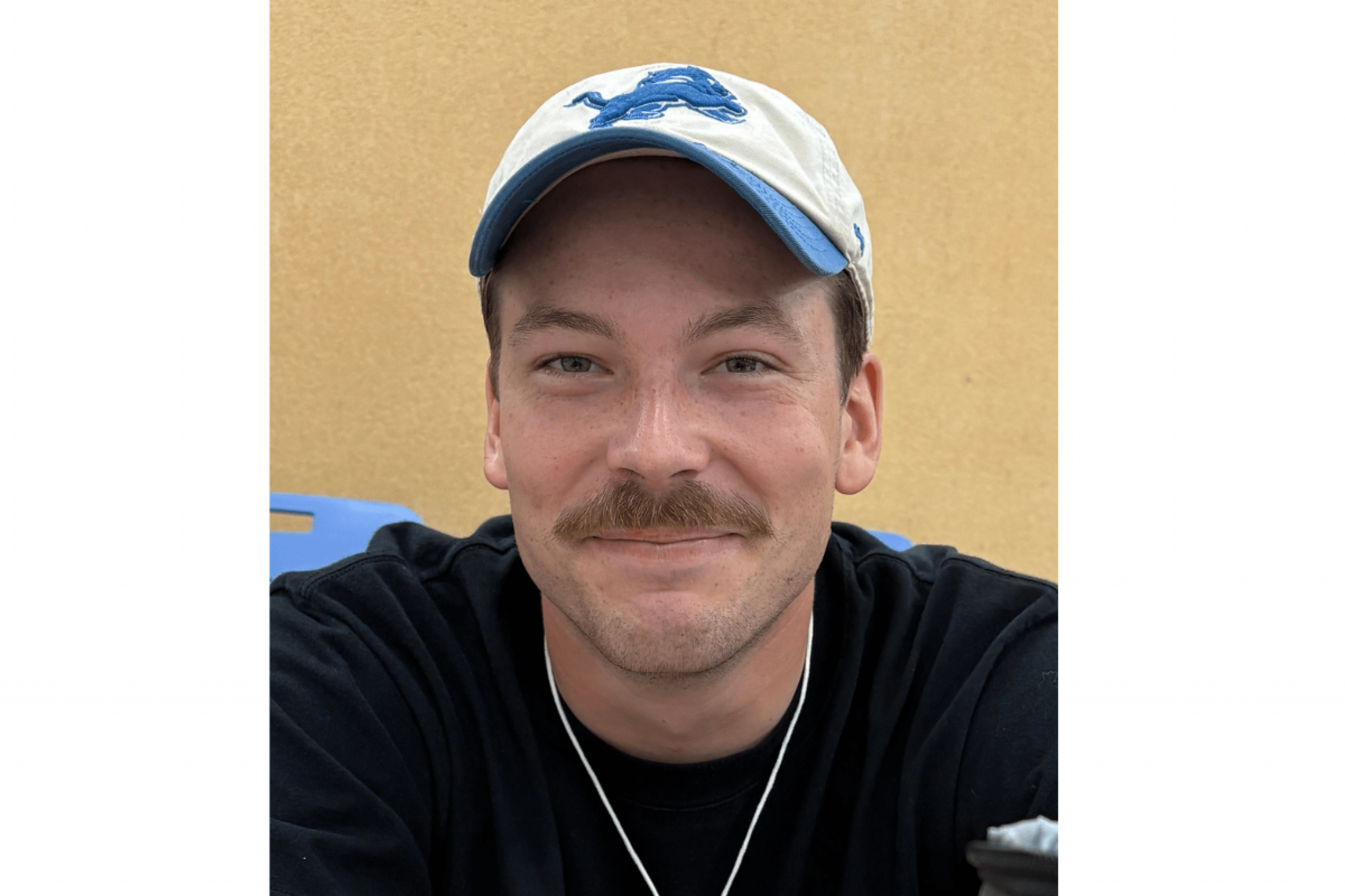 male student wearing baseball hat