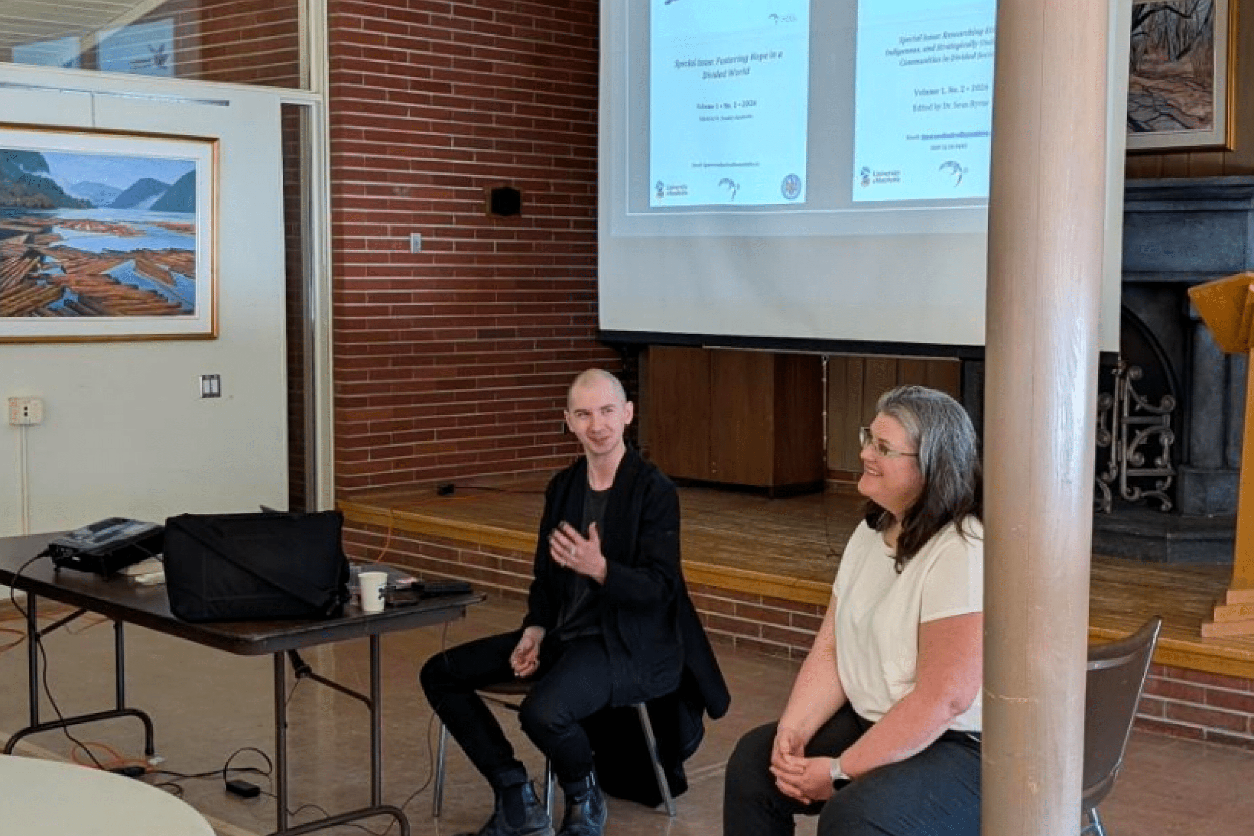 2 librarians presenting in front of a projector