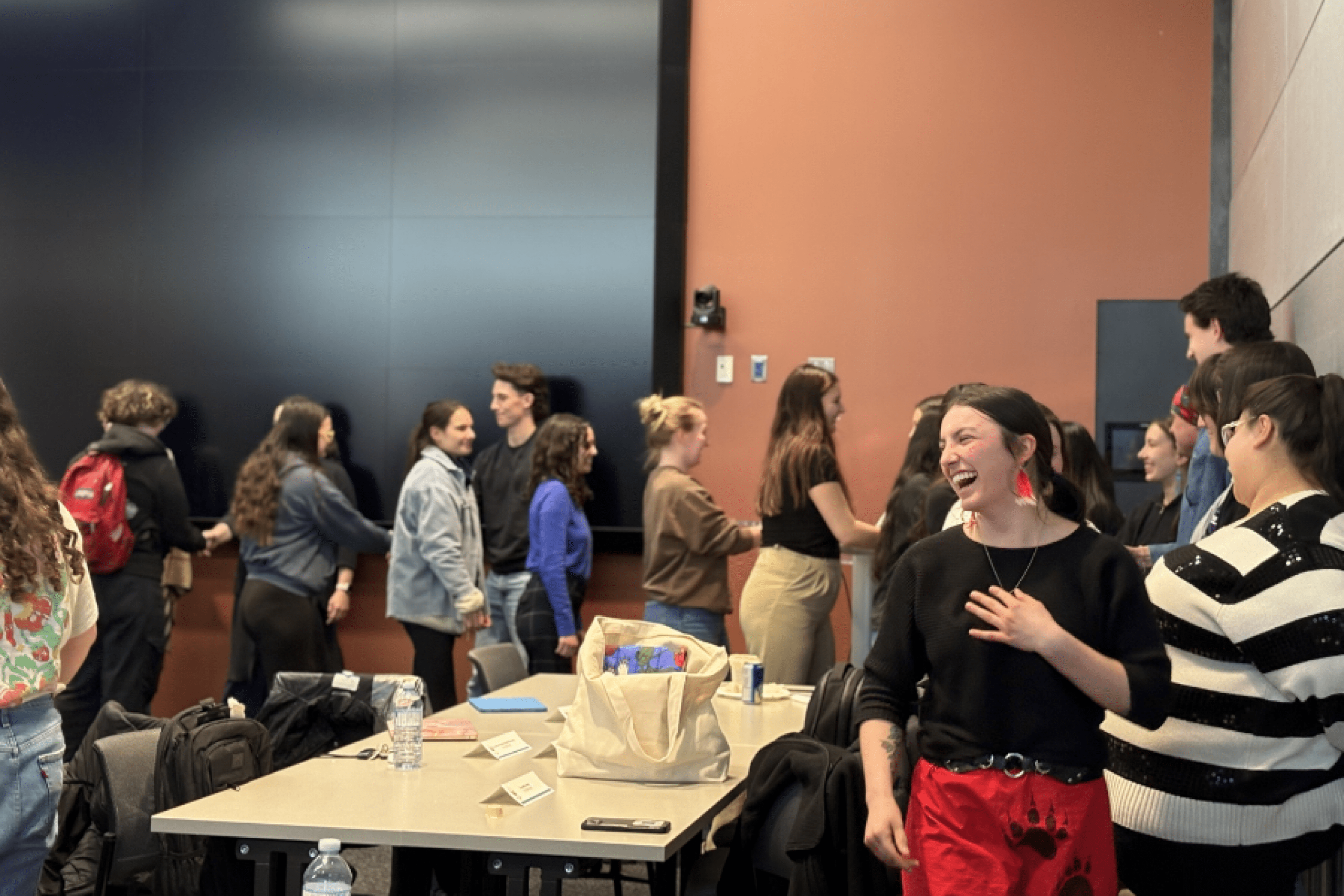 Students interacting in a classroom during a group activity.