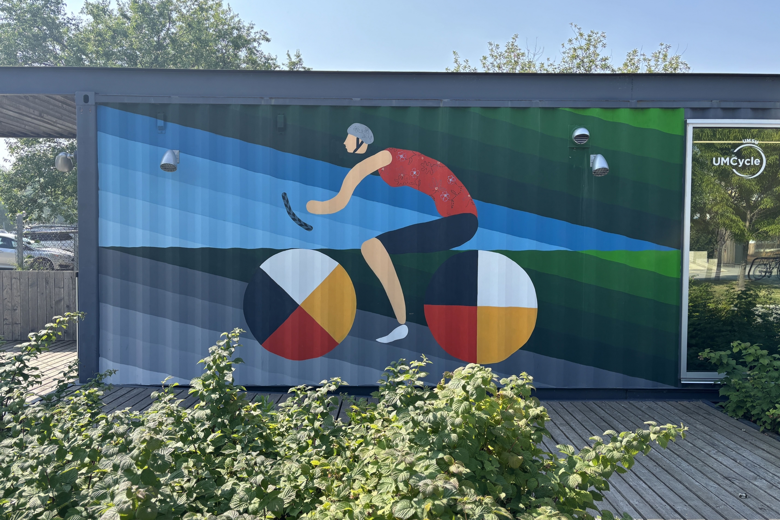 mural of a cyclist painted outdoors.
