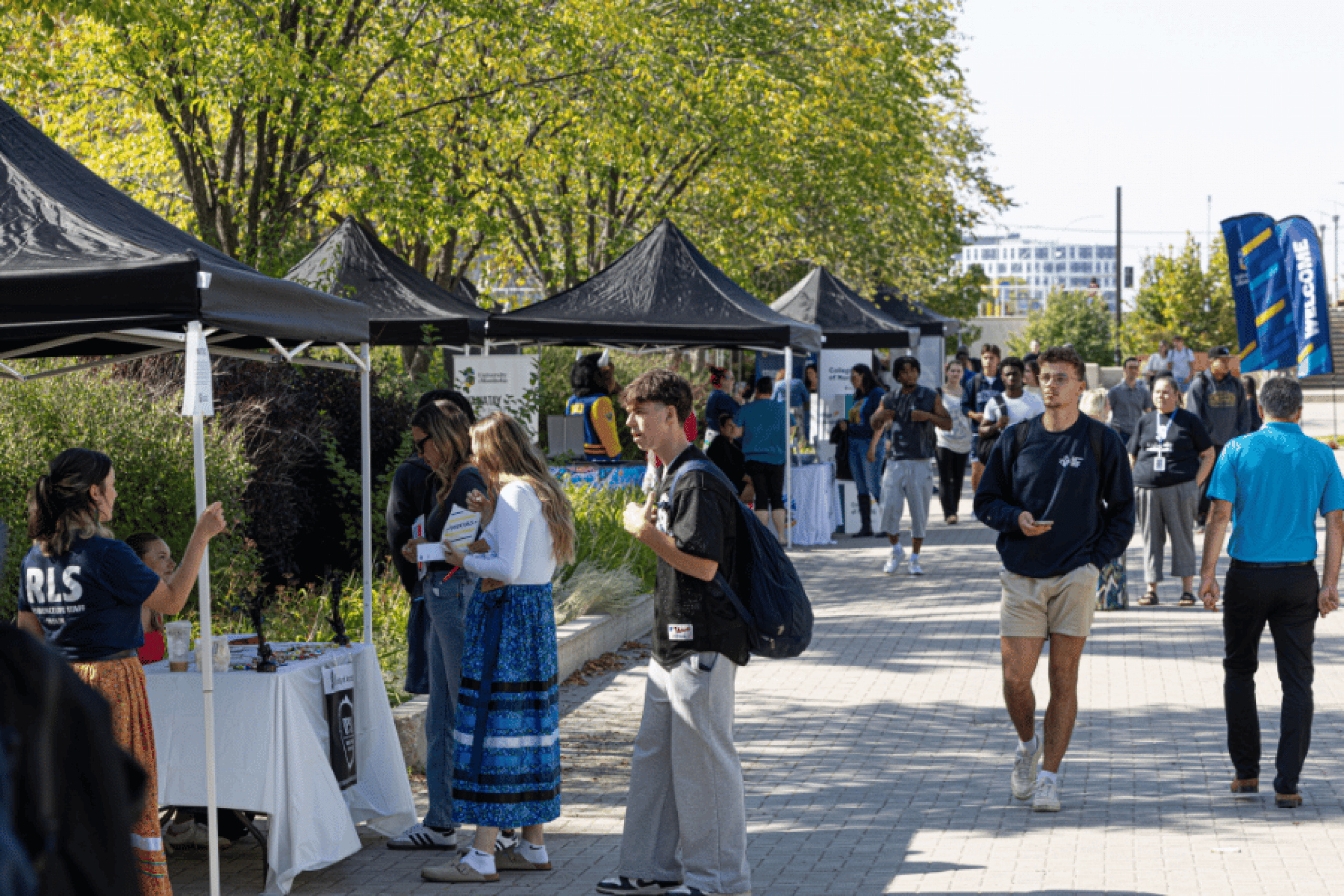 4. Students visiting outdoor resource booths at Indigenous Orientation.