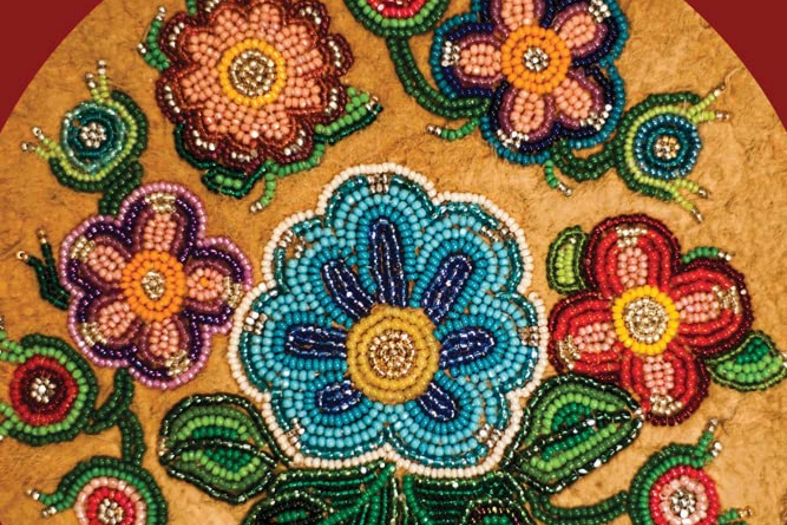 Book cover with beaded design on it