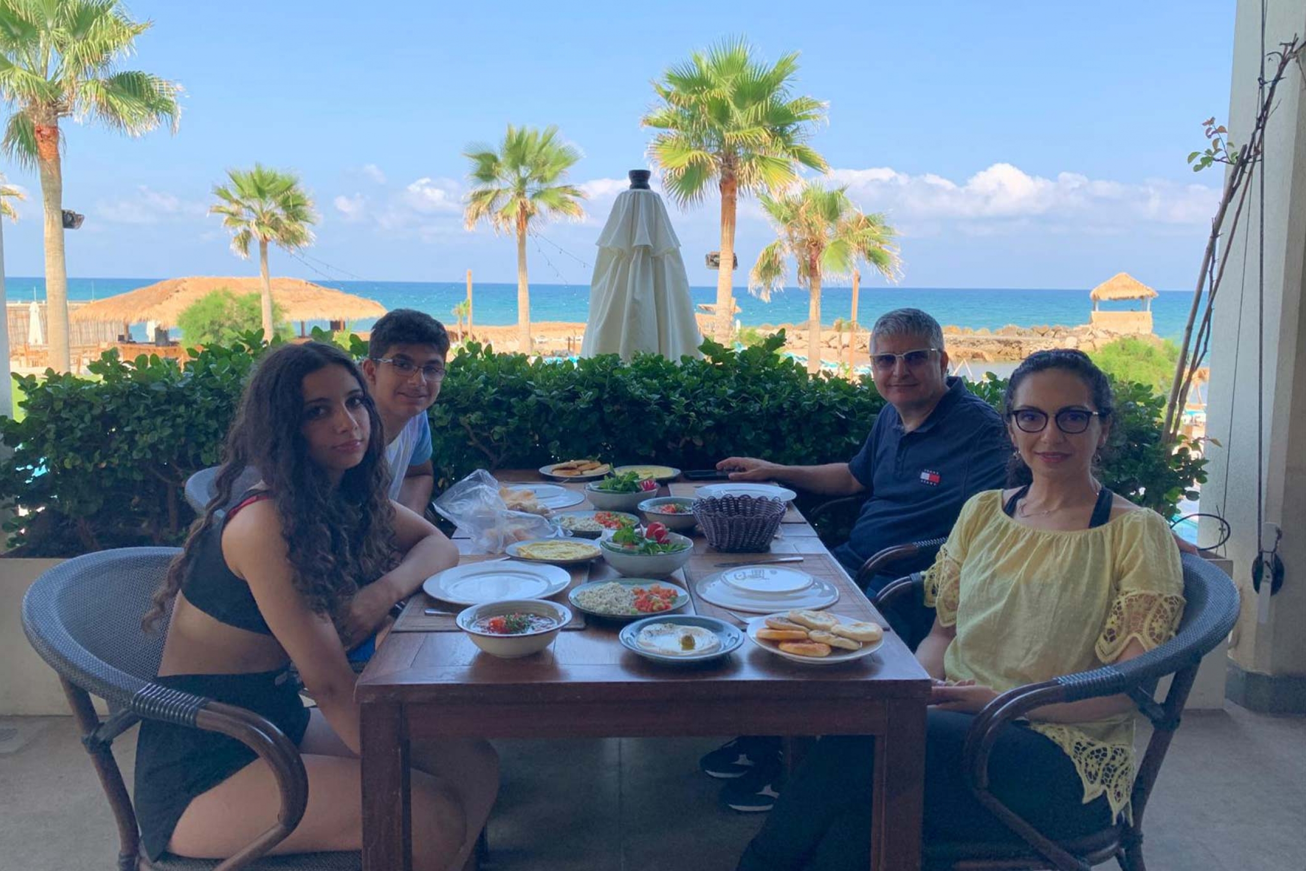 Khodr Shamseddin with his family at a restaurant in Lebanon.