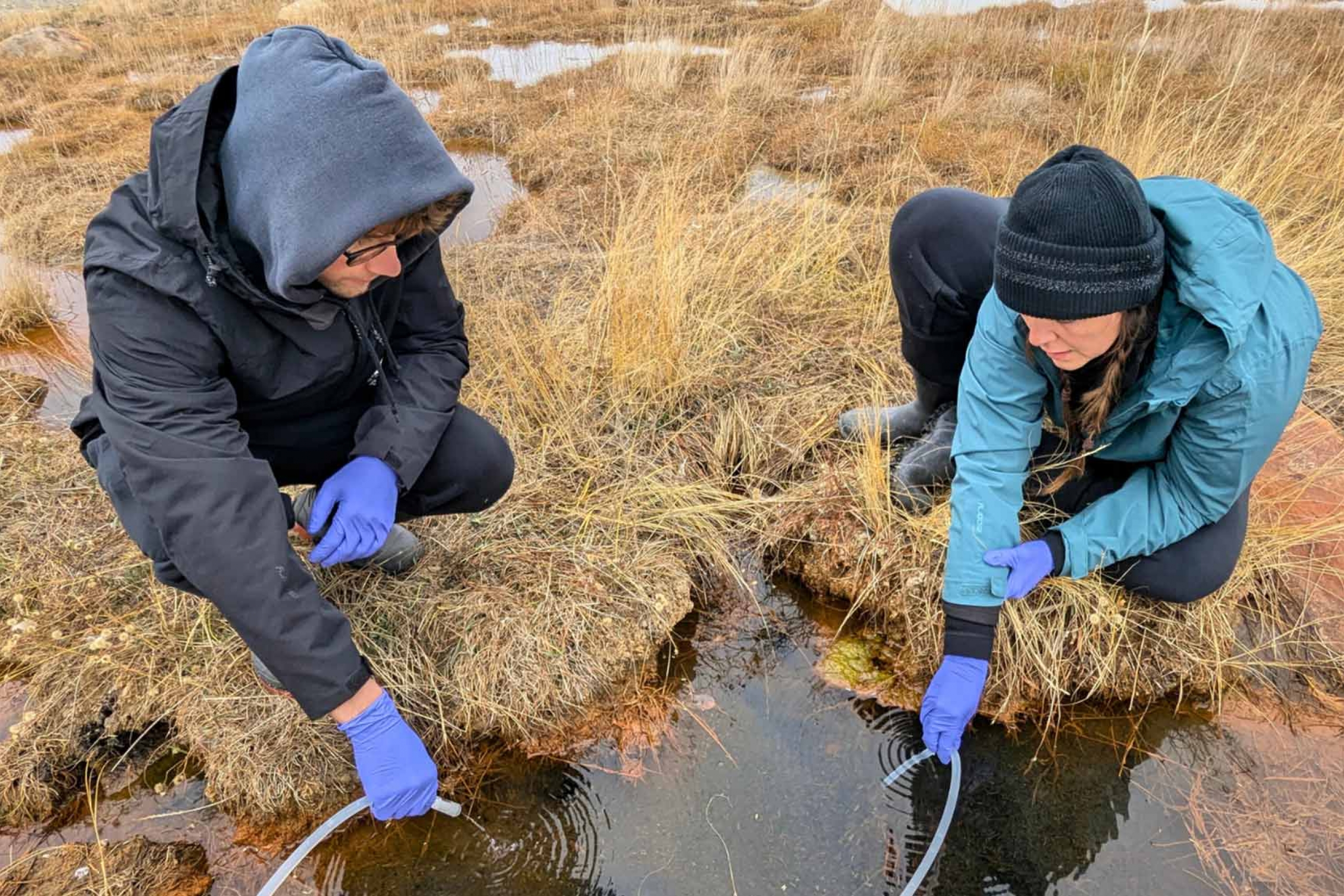 Marike Palmer and a student in the field.