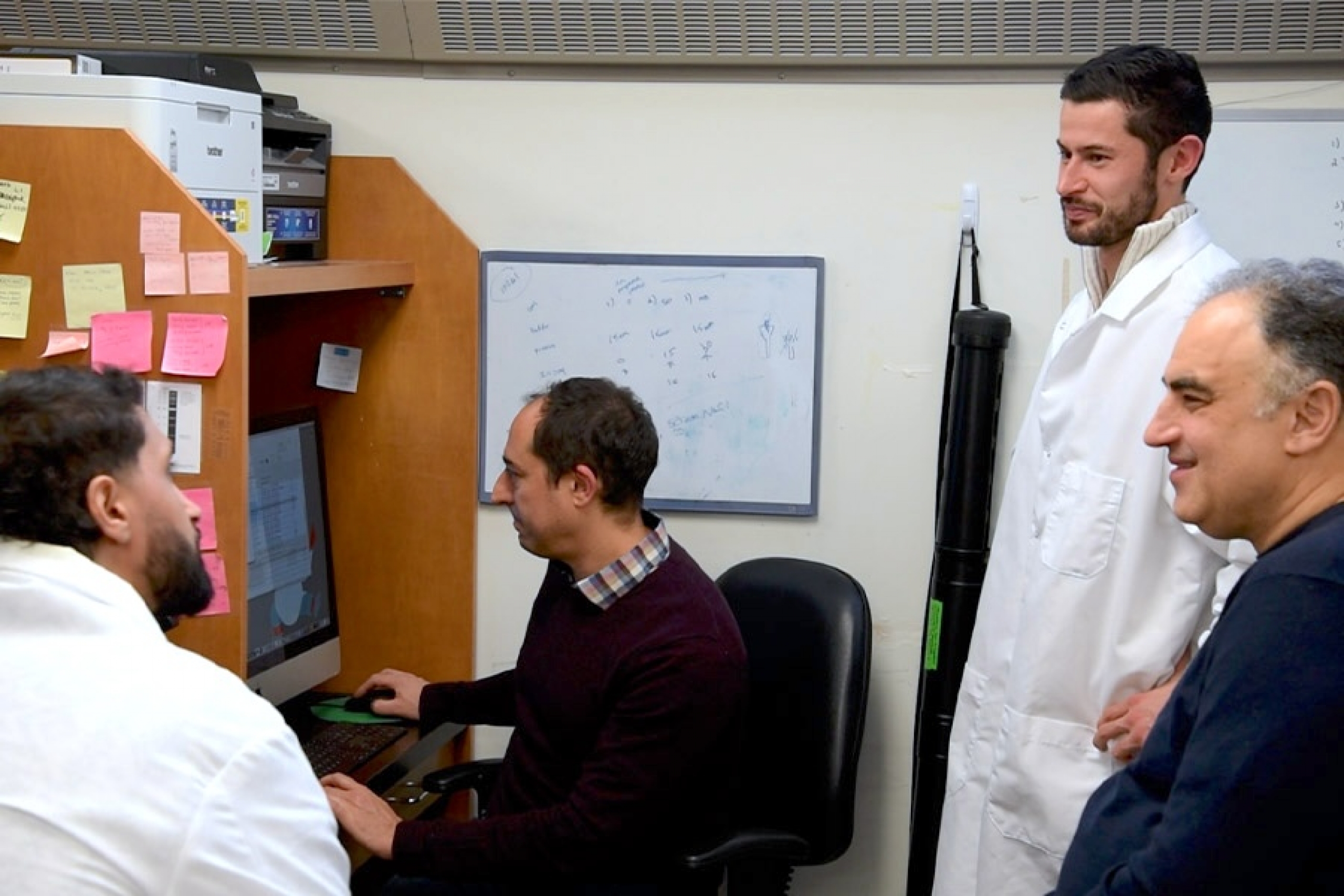 Matthew Van Schepdael, Gerd Prehna, Mazdak Khajehpour, Iman Asakereh discussing about the research.