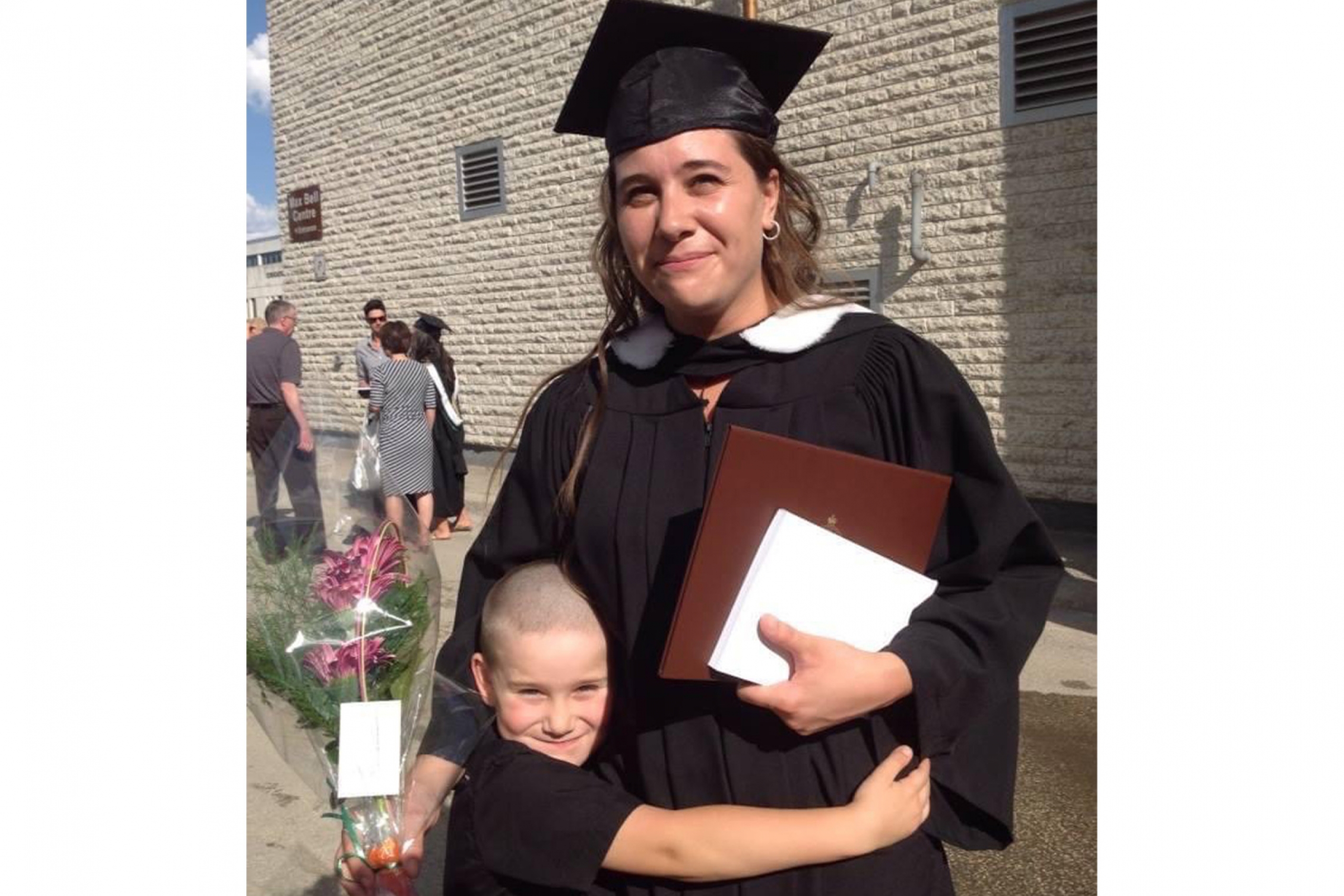 Melanie Lalonde with her son during her bachelor's degree graduation.