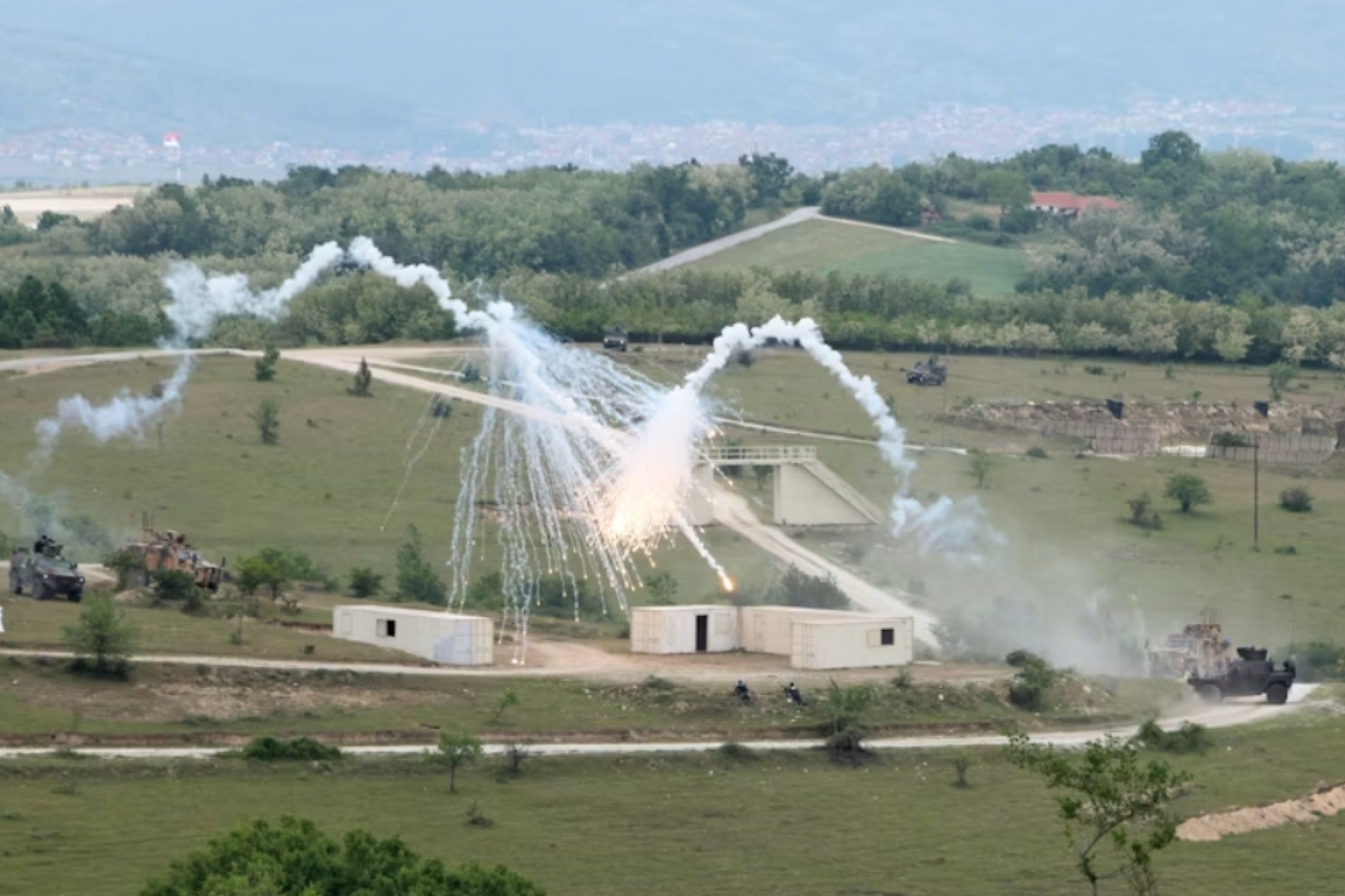 military explosion on a field