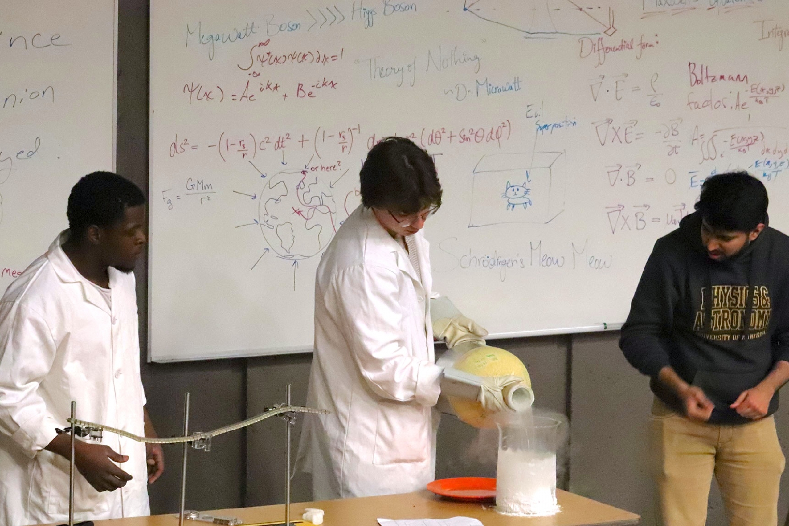 Scientist demonstrating a physics experiment.