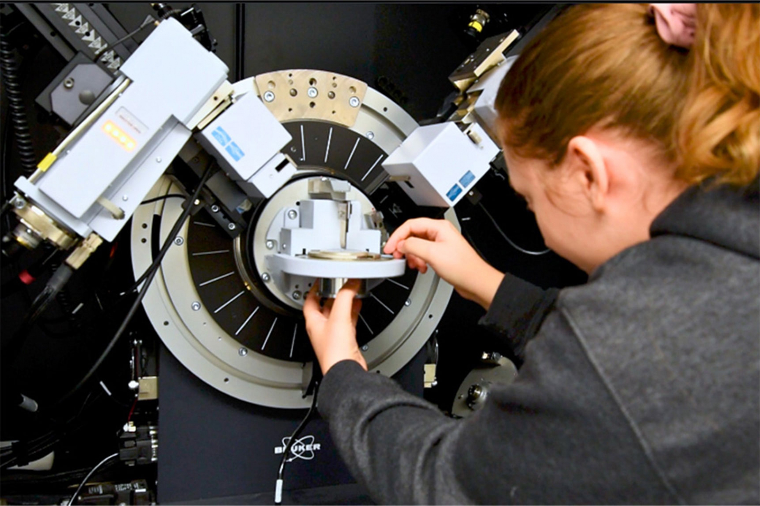 Physics student with the bruker d8 discover x-ray diffractometer.