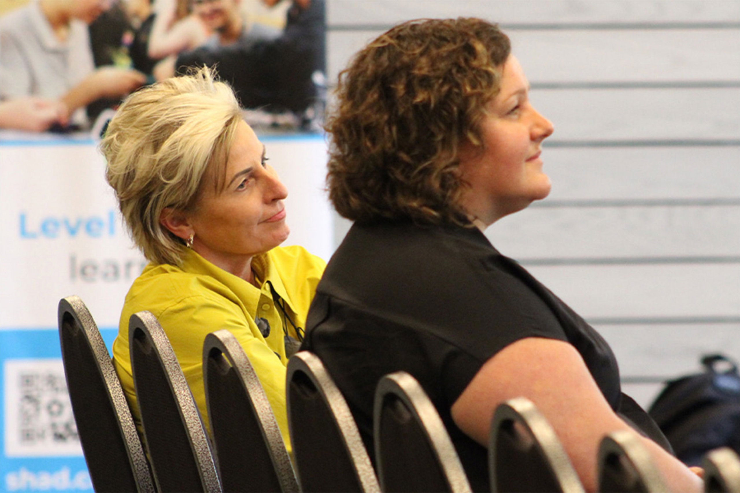 Krystyna Koczanski and Janine Carmichael watching the students presentation at the open house.