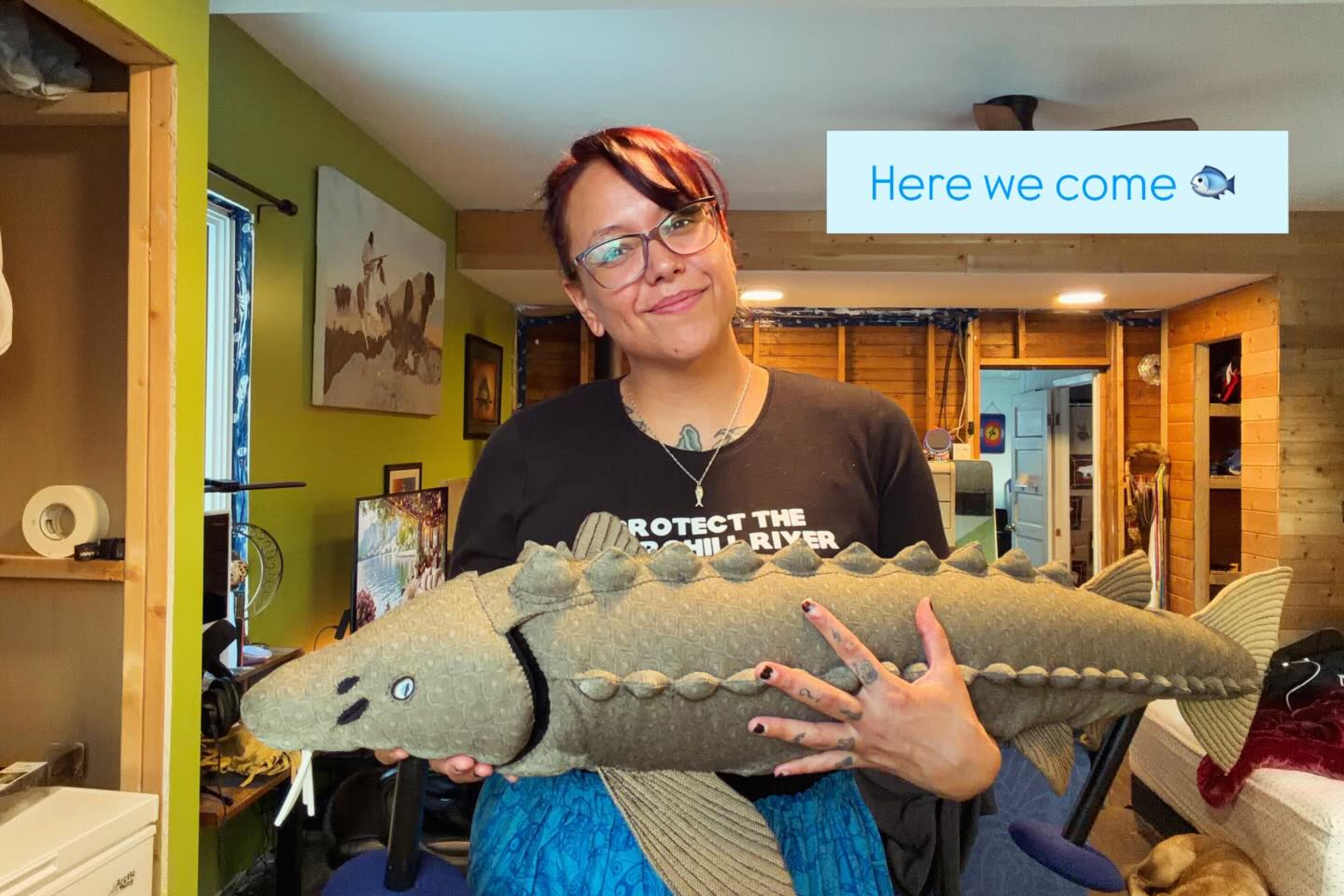 Taylor holding her sturgeon puppet.