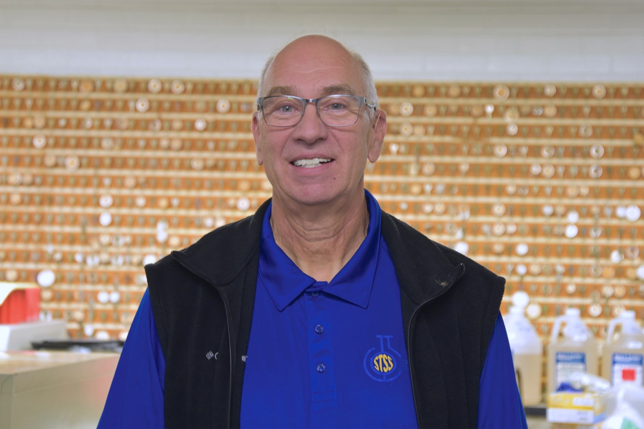 Terry wearing a blue STSS shirt smiling at the camera.