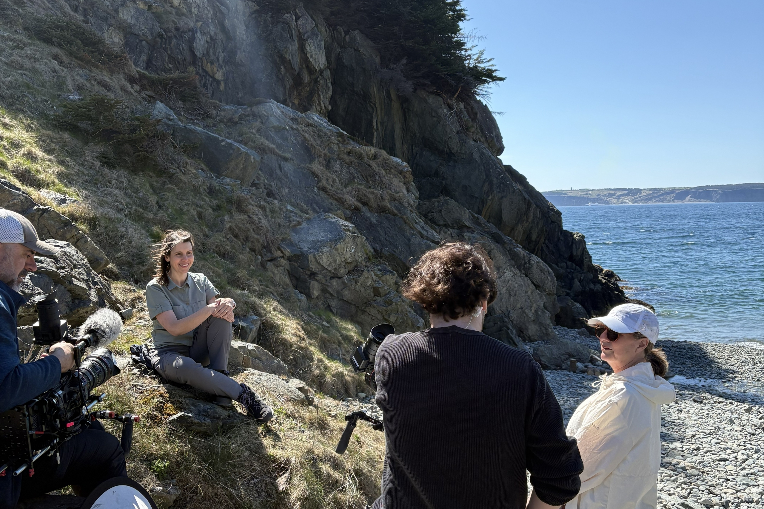 A filming crew setting up shots with Dr. Marson on the coast of Newfoundland.