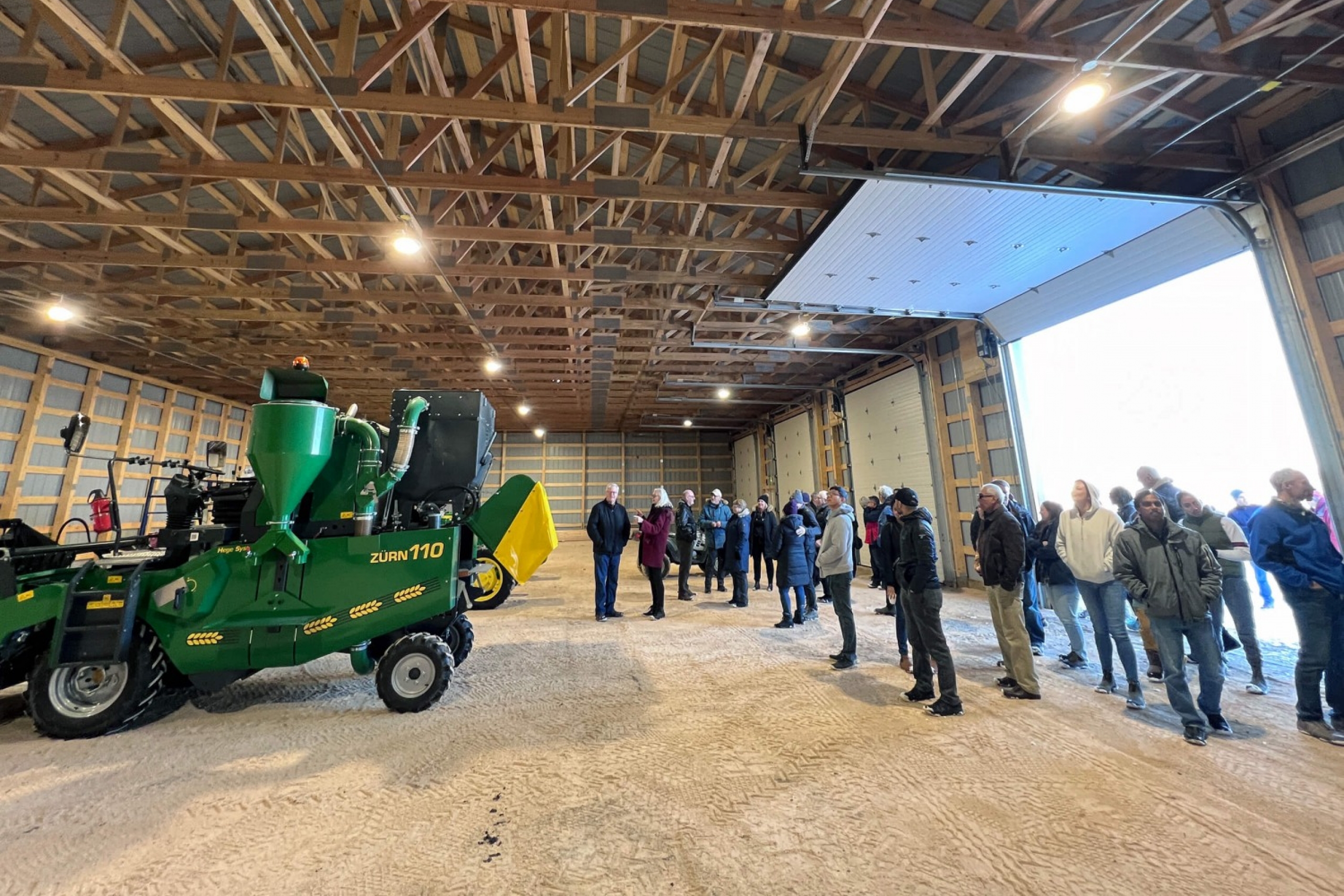 Carmen research barn, people view a tractor