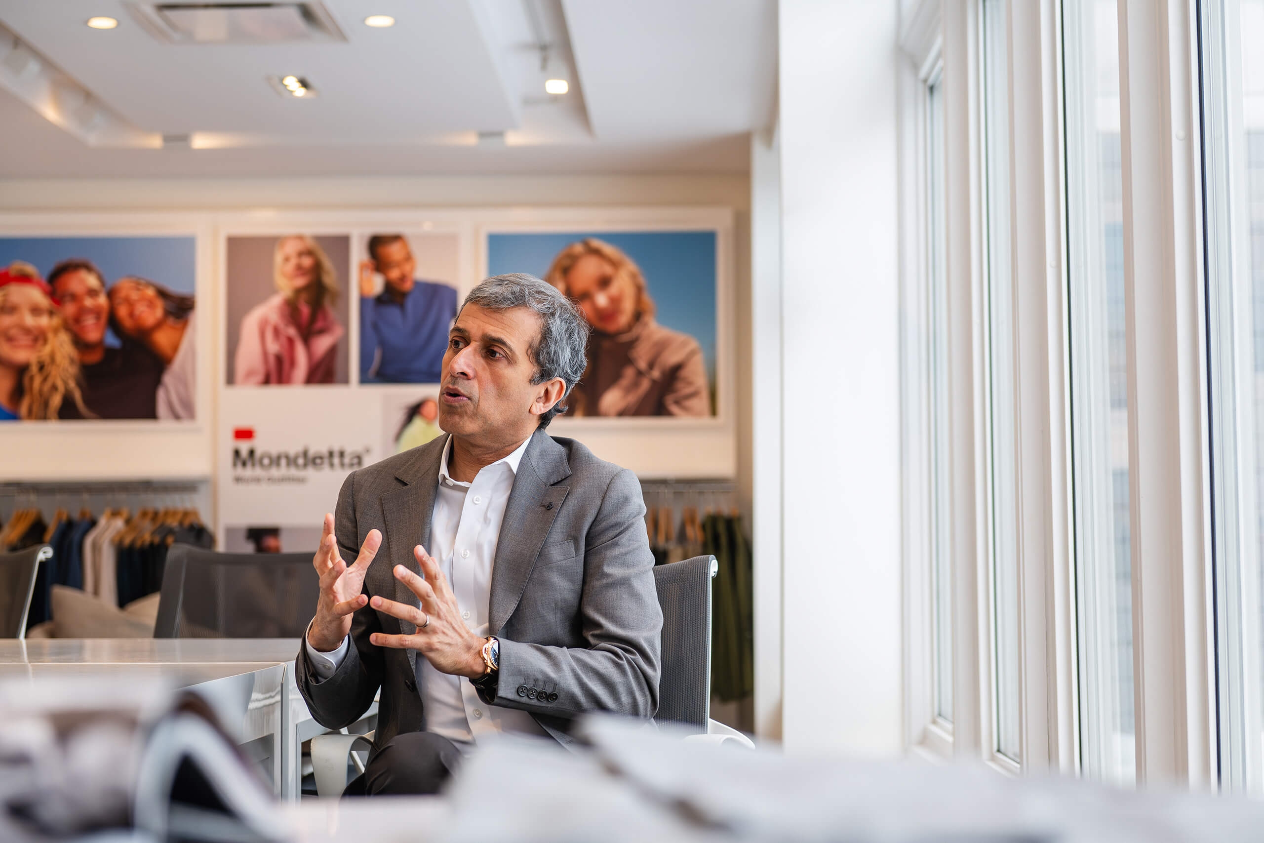 A man speaking, using his hands
