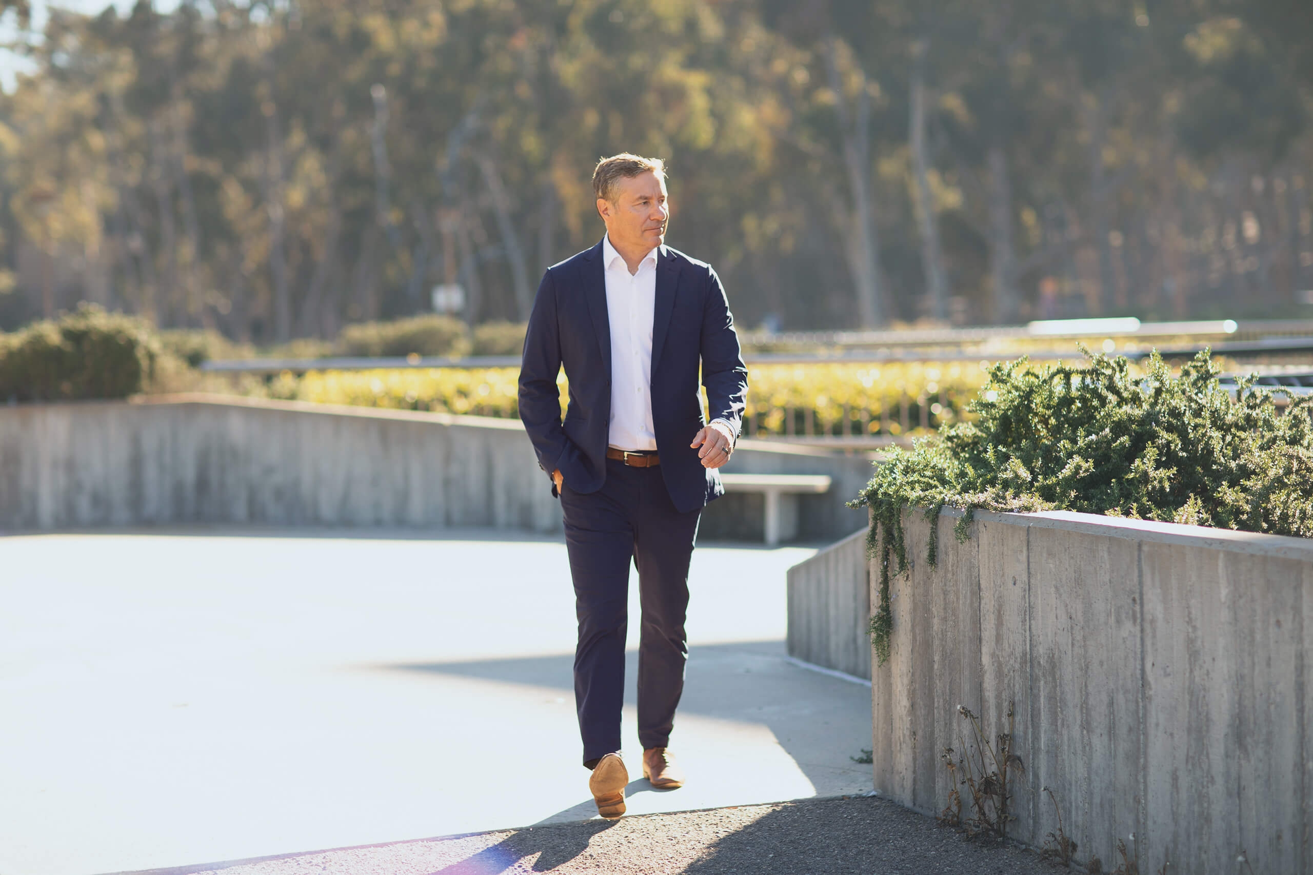 A man in a suit walking