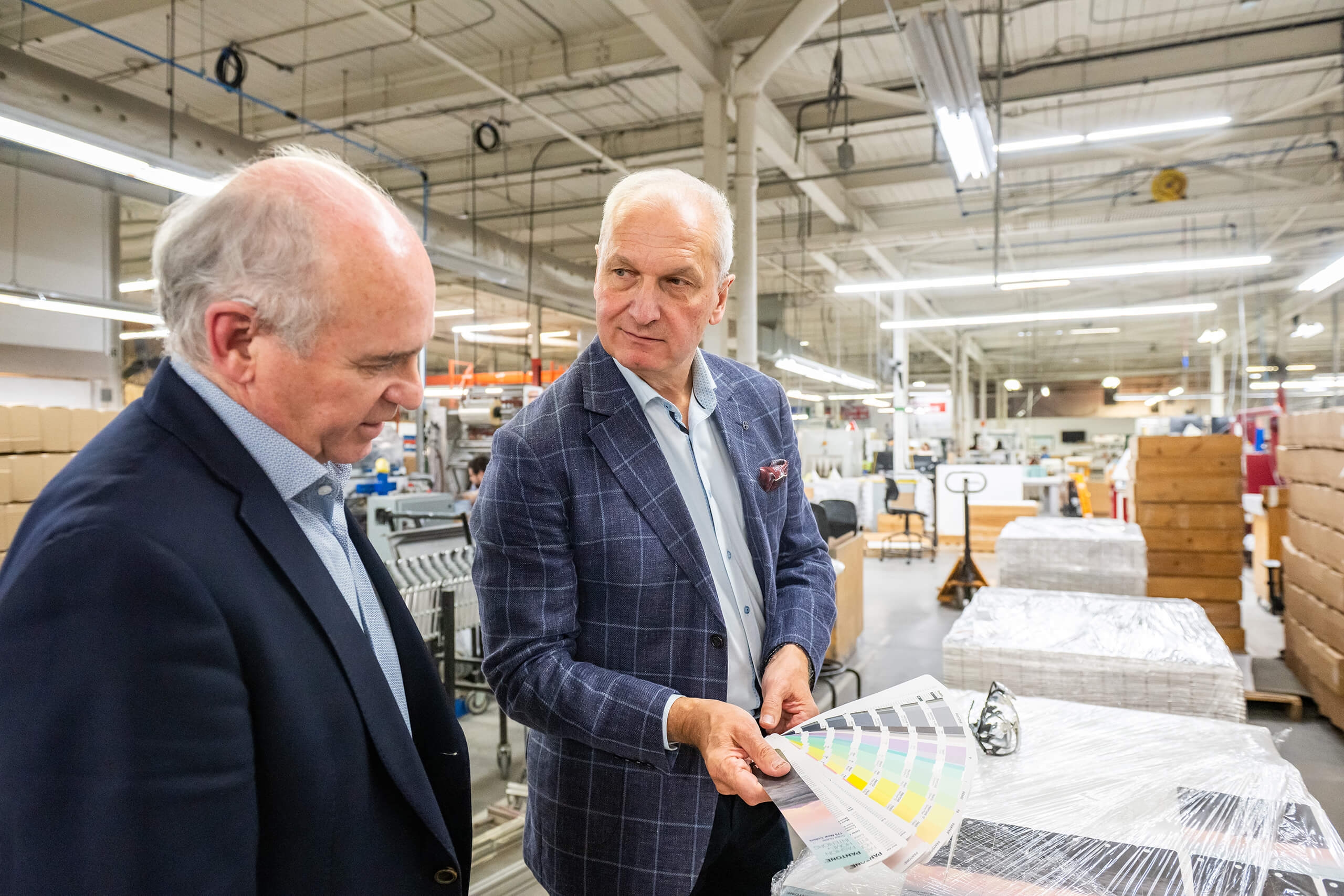 two men in a factory