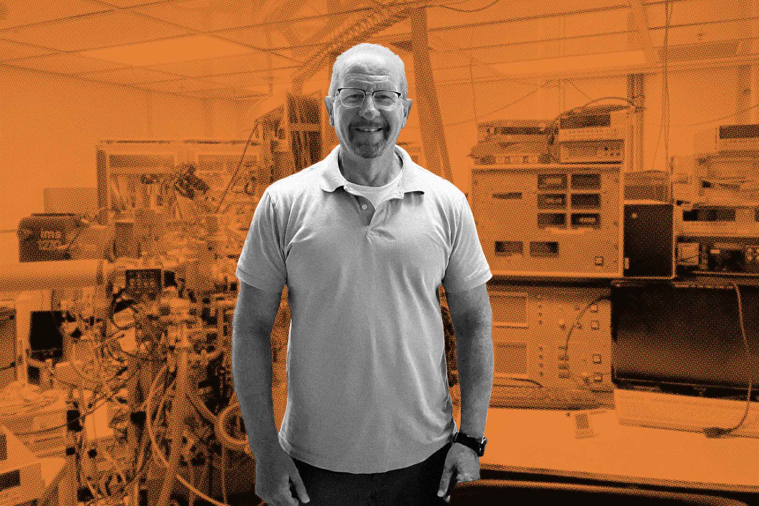 A man standing in front a research space