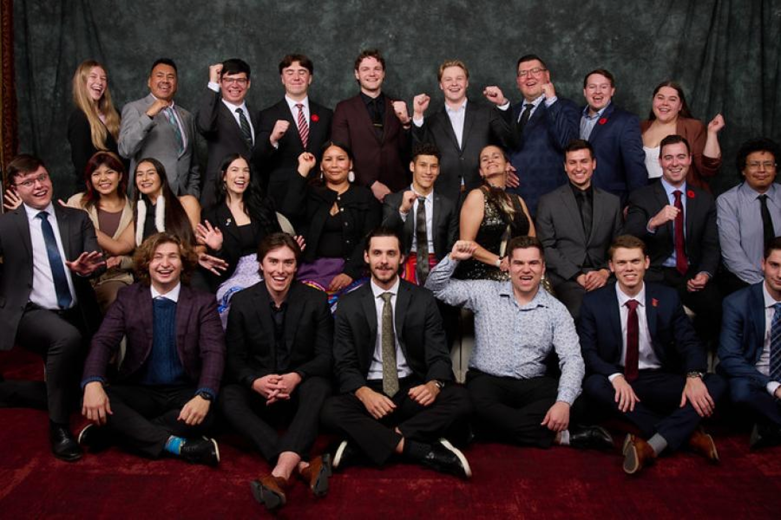 A group poses at the VIBE award