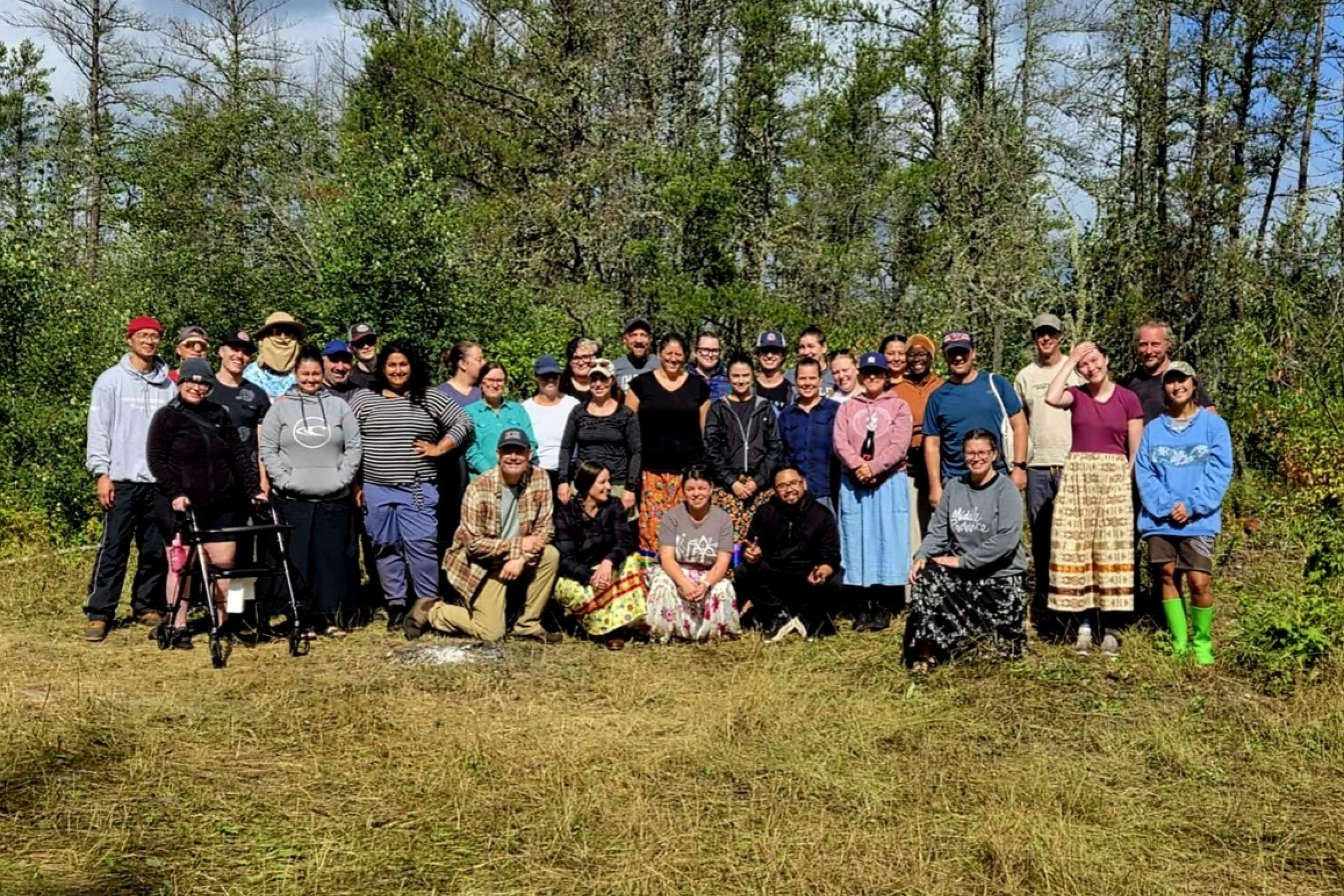 group shot of students outdoors in forest