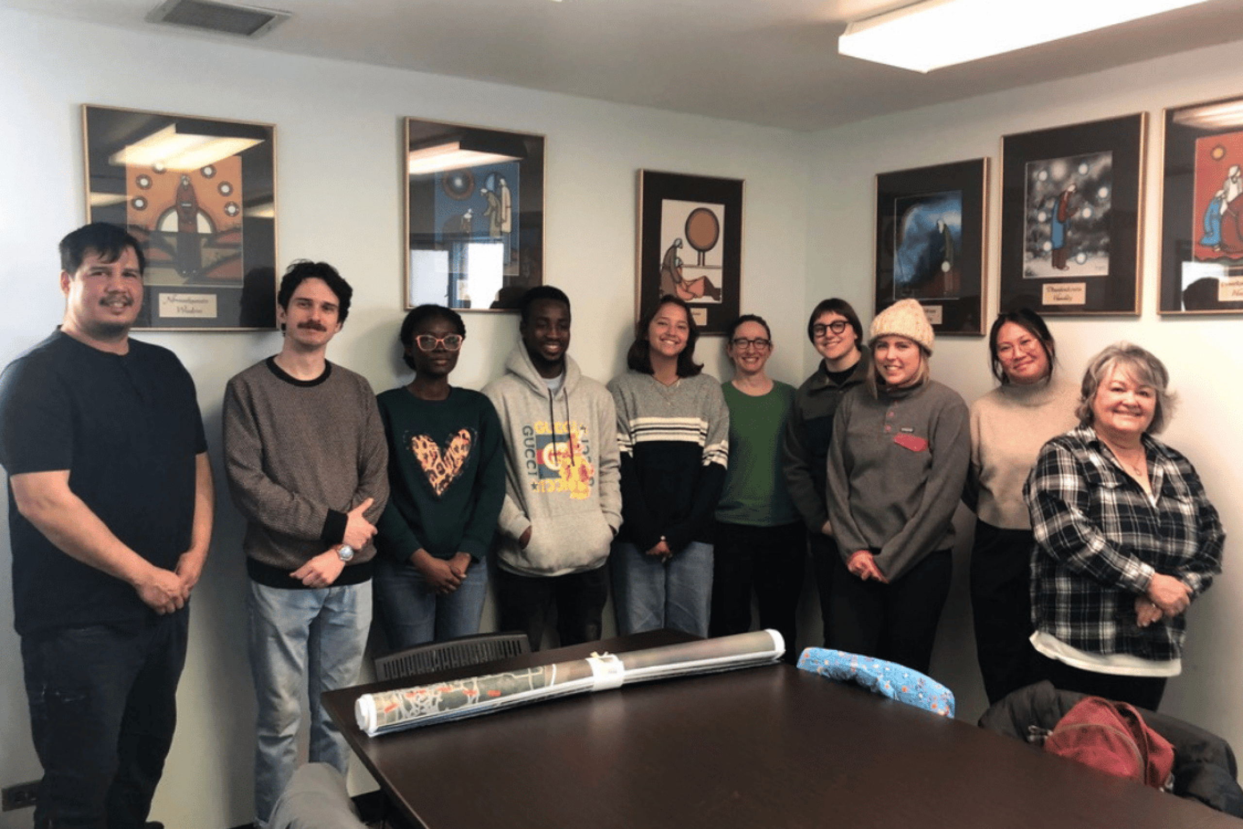 14. Students and community members pose together during a workshop visit.